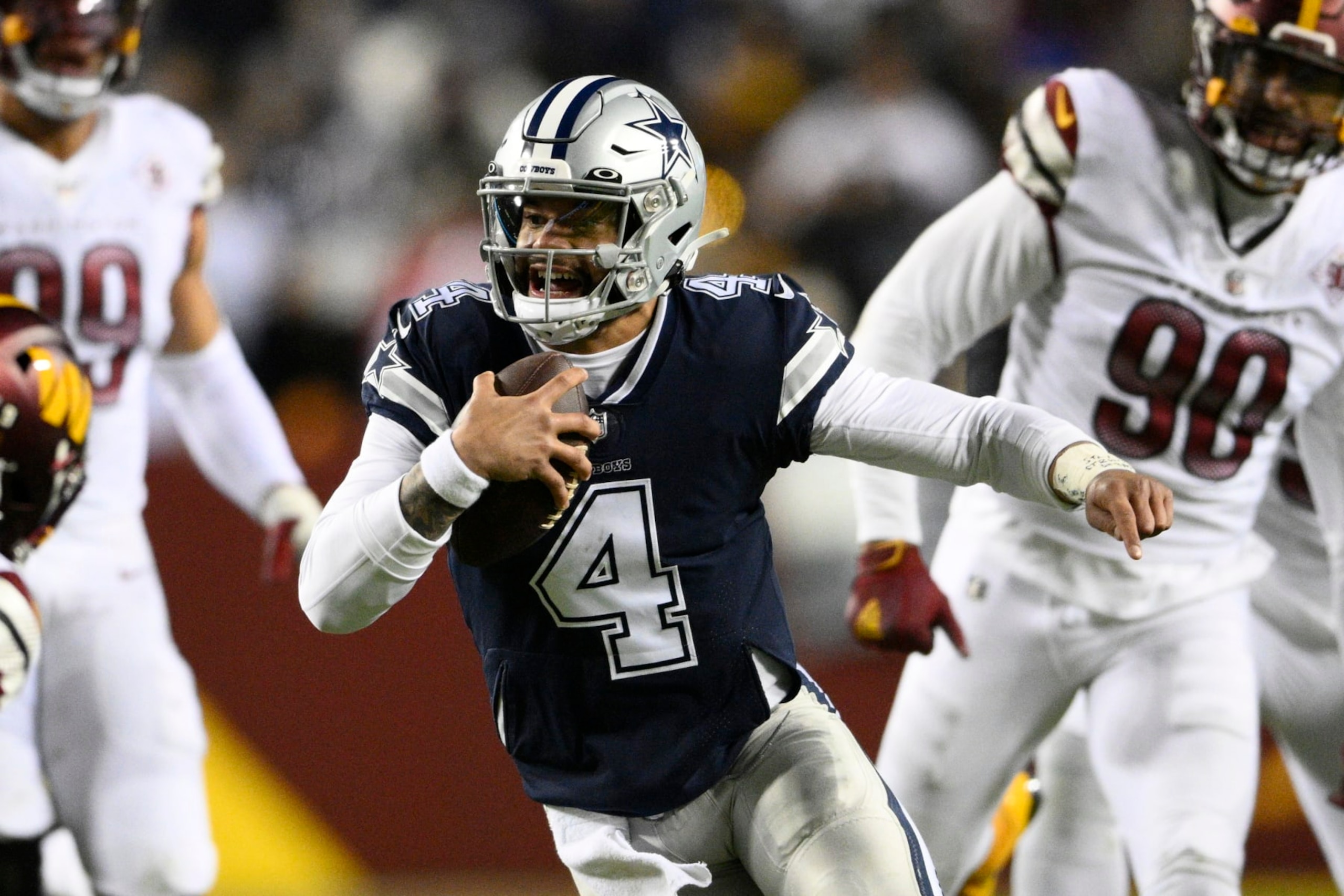 Dallas Cowboys quarterback Dak Prescott (4) in action during the first half of an NFL football game against the Washington Commanders, Sunday, Jan. 8, 2023, in Landover, Md. (AP Photo/Nick Wass)