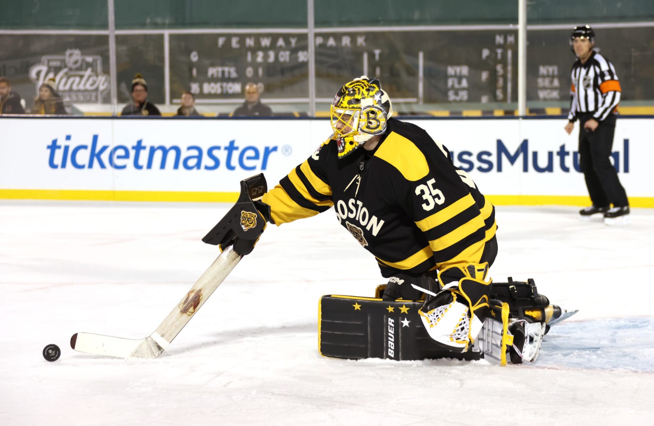 BOSTON, MASSACHUSETTS - JANUARY 02: Goaltender Linus Ullmark #35 of the Boston Bruins plays the puck in the third period during the 2023 Discover NHL Winter Classic game between the Pittsburgh Penguins and the Boston Bruins at Fenway Park on January 02, 2023 in Boston, Massachusetts. (Photo by Dave Sandford/NHLI via Getty Images) BOSTON, MASSACHUSETTS - JANUARY 02: Goaltender Linus Ullmark #35 of the Boston Bruins plays the puck in the third period during the 2023 Discover NHL Winter Classic game between the Pittsburgh Penguins and the Boston Bruins at Fenway Park on January 02, 2023 in Boston, Massachusetts. (Photo by Dave Sandford/NHLI via Getty Images)