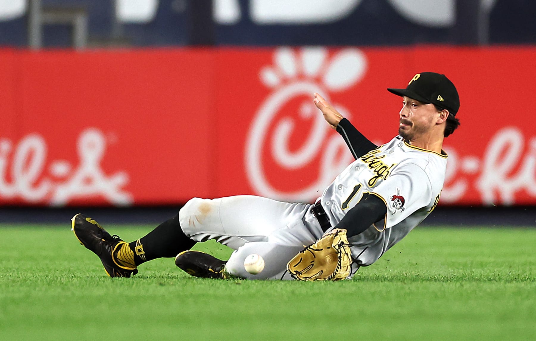 NEW YORK, NEW YORK - SEPTEMBER 20:  Bryan Reynolds #10 of the Pittsburgh Pirates slides but misses the ball off the bat of Jose Trevino #39 of the New York Yankees that scores Harrison Bader #22 during the 5th inning of the game at Yankee Stadium on September 20, 2022 in the Bronx borough of New York City. (Photo by Jamie Squire/Getty Images)