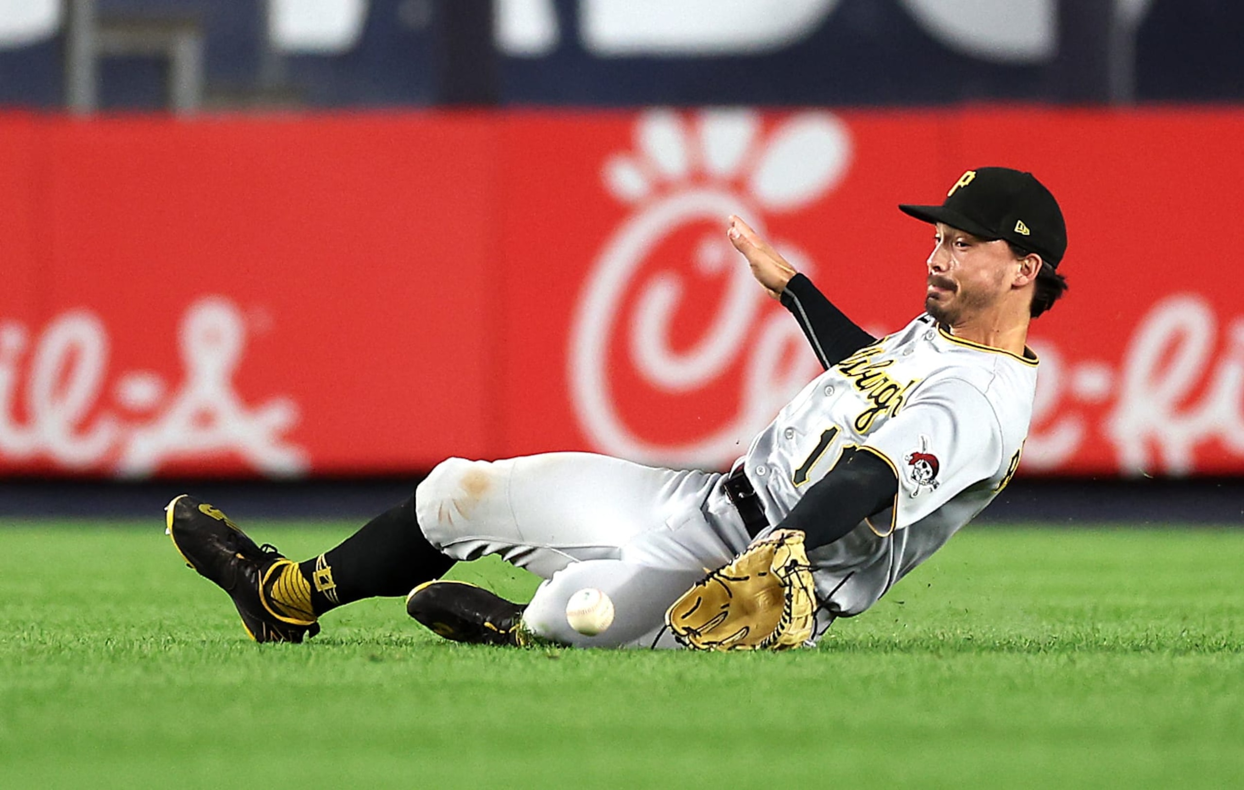 NEW YORK, NEW YORK - SEPTEMBER 20:  Bryan Reynolds #10 of the Pittsburgh Pirates slides but misses the ball off the bat of Jose Trevino #39 of the New York Yankees that scores Harrison Bader #22 during the 5th inning of the game at Yankee Stadium on September 20, 2022 in the Bronx borough of New York City. (Photo by Jamie Squire/Getty Images)