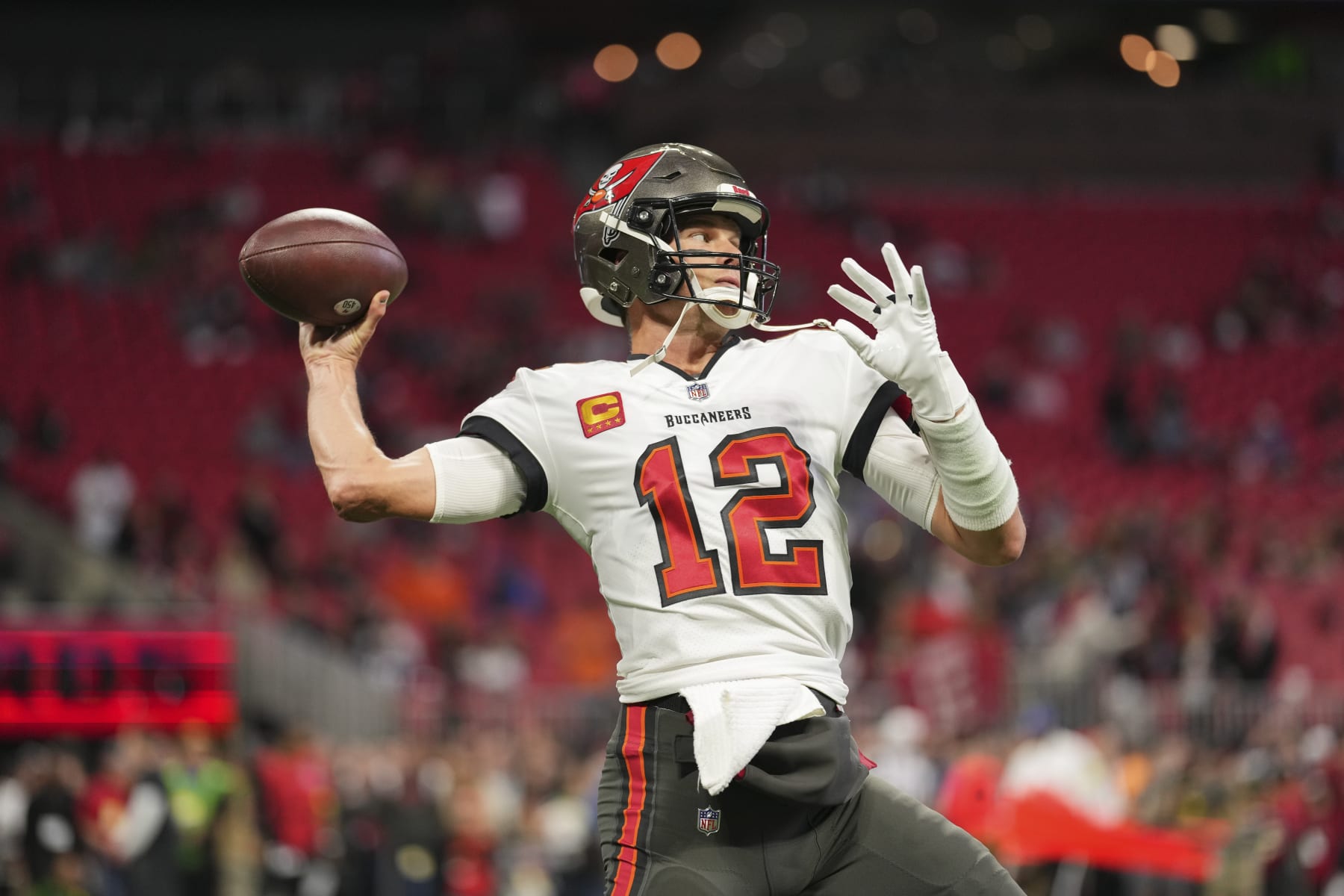 ATLANTA, GA - JANUARY 08: Tom Brady #12 of the Tampa Bay Buccaneers warms up against the Atlanta Falcons at Mercedes-Benz Stadium on January 8, 2023 in Atlanta, Georgia. (Photo by Cooper Neill/Getty Images)