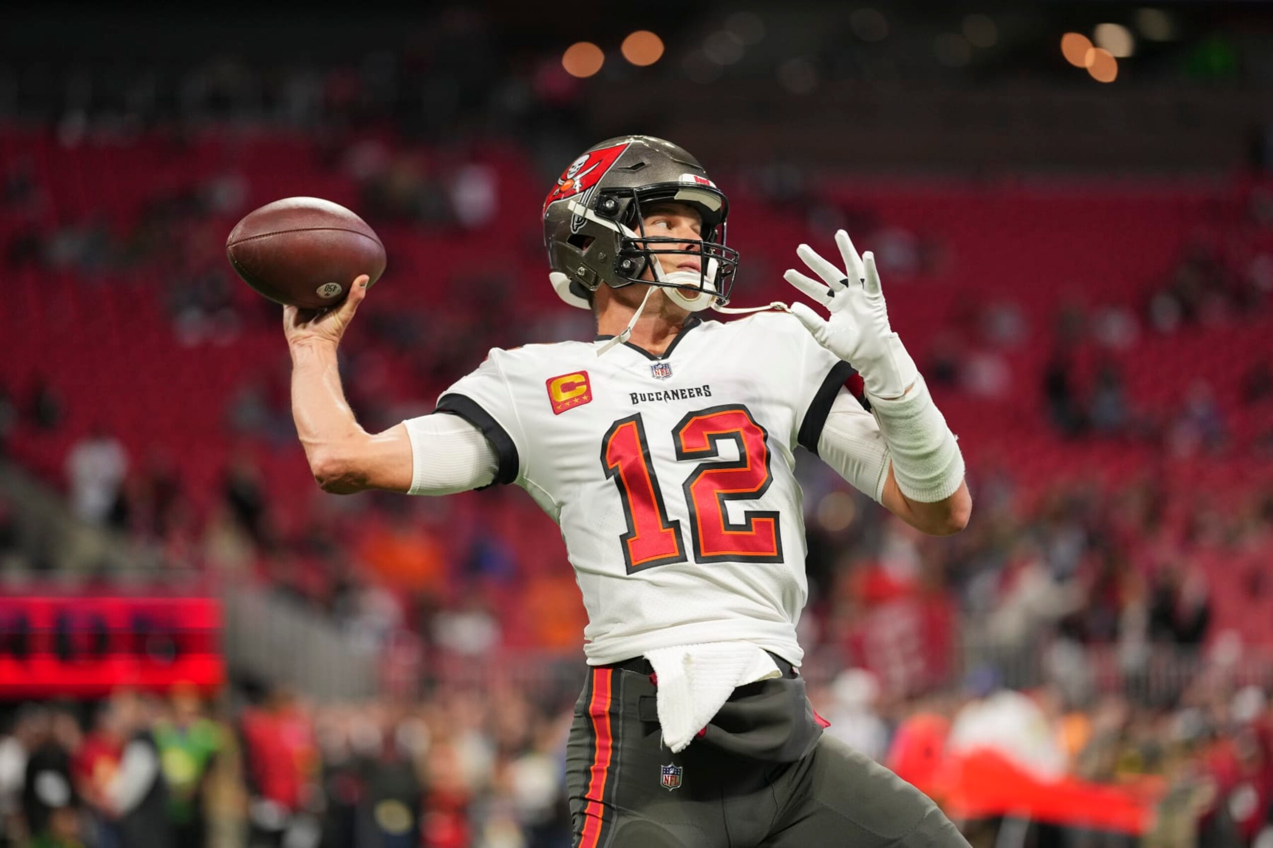 ATLANTA, GA - JANUARY 08: Tom Brady #12 of the Tampa Bay Buccaneers warms up against the Atlanta Falcons at Mercedes-Benz Stadium on January 8, 2023 in Atlanta, Georgia. (Photo by Cooper Neill/Getty Images)