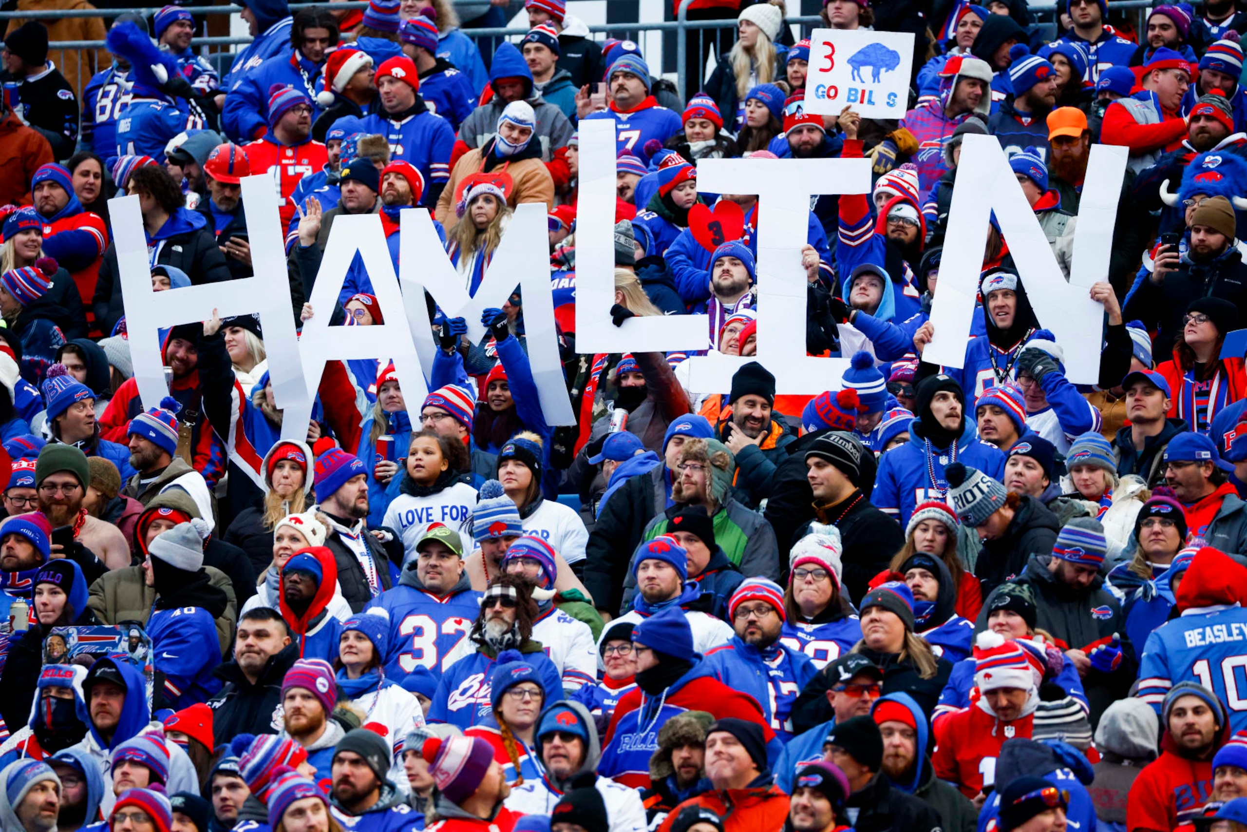 FILE - Fans hold a sign in support of Buffalo Bills safety Damar Hamlin during the second half of an NFL football game against the New England Patriots, Sunday, Jan. 8, 2023, in Orchard Park. Bills safety Damar Hamlin was released from a Buffalo hospital on Wednesday, Jan. 11, 2023, after his doctors said they completed a series of tests a little over a week after he went into cardiac arrest and had to be resuscitated during a game at Cincinnati. (AP Photo/Jeffrey T. Barnes, File)
