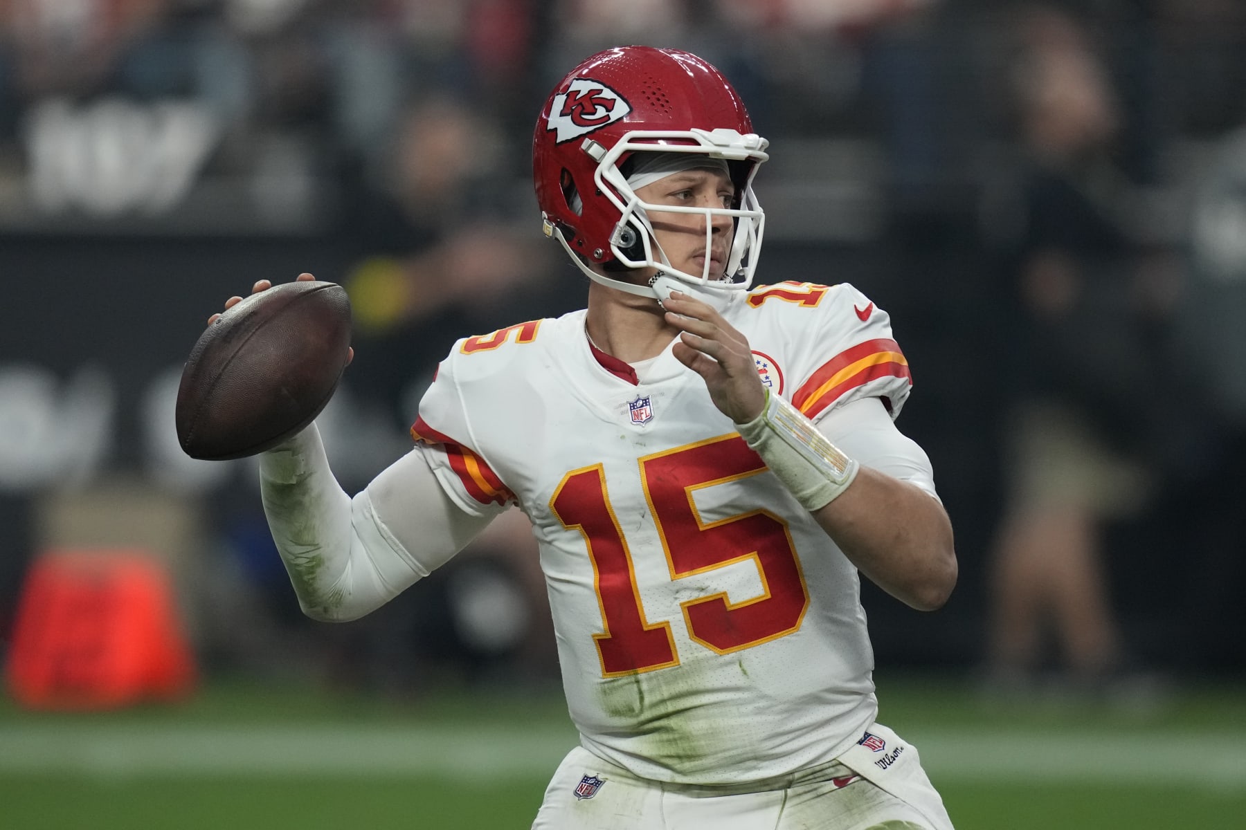 Kansas City Chiefs quarterback Patrick Mahomes (15) looks to throw against the Las Vegas Raiders during the second half of an NFL football game, Wednesday, Jan. 11, 2023, in Las Vegas. (AP Photo/John Locher)