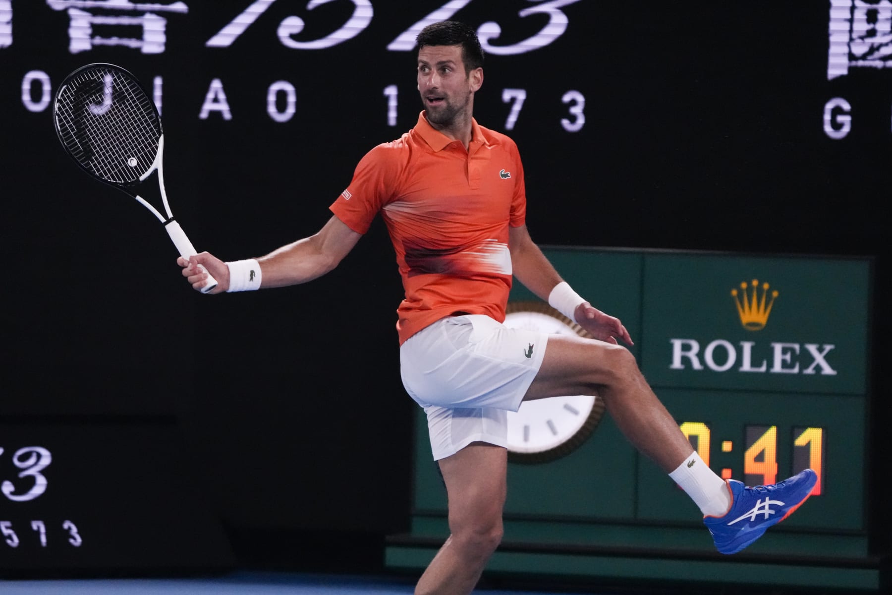 Serbia's Novak Djokovic returns a shot to Australia's Nick Kyrgios during an exhibition match on Rod Laver Arena ahead of the Australian Open tennis championship in Melbourne, Australia, Friday, Jan. 13, 2023. (AP Photo/Mark Baker)