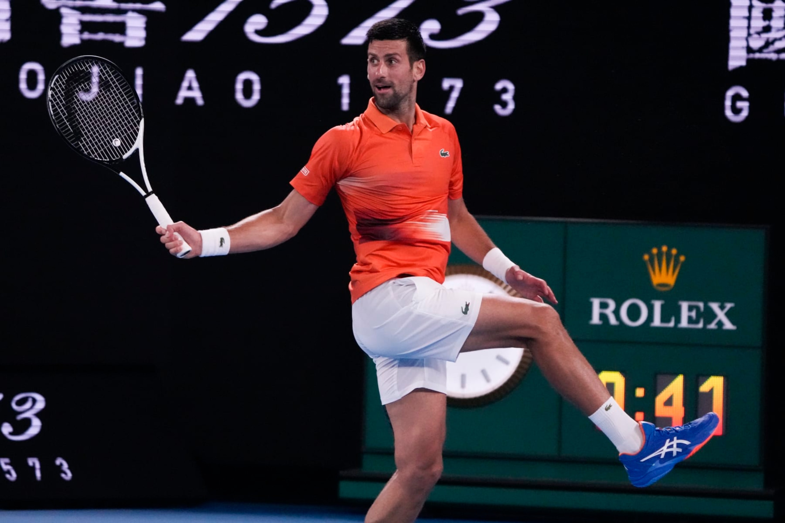 Serbia's Novak Djokovic returns a shot to Australia's Nick Kyrgios during an exhibition match on Rod Laver Arena ahead of the Australian Open tennis championship in Melbourne, Australia, Friday, Jan. 13, 2023. (AP Photo/Mark Baker)