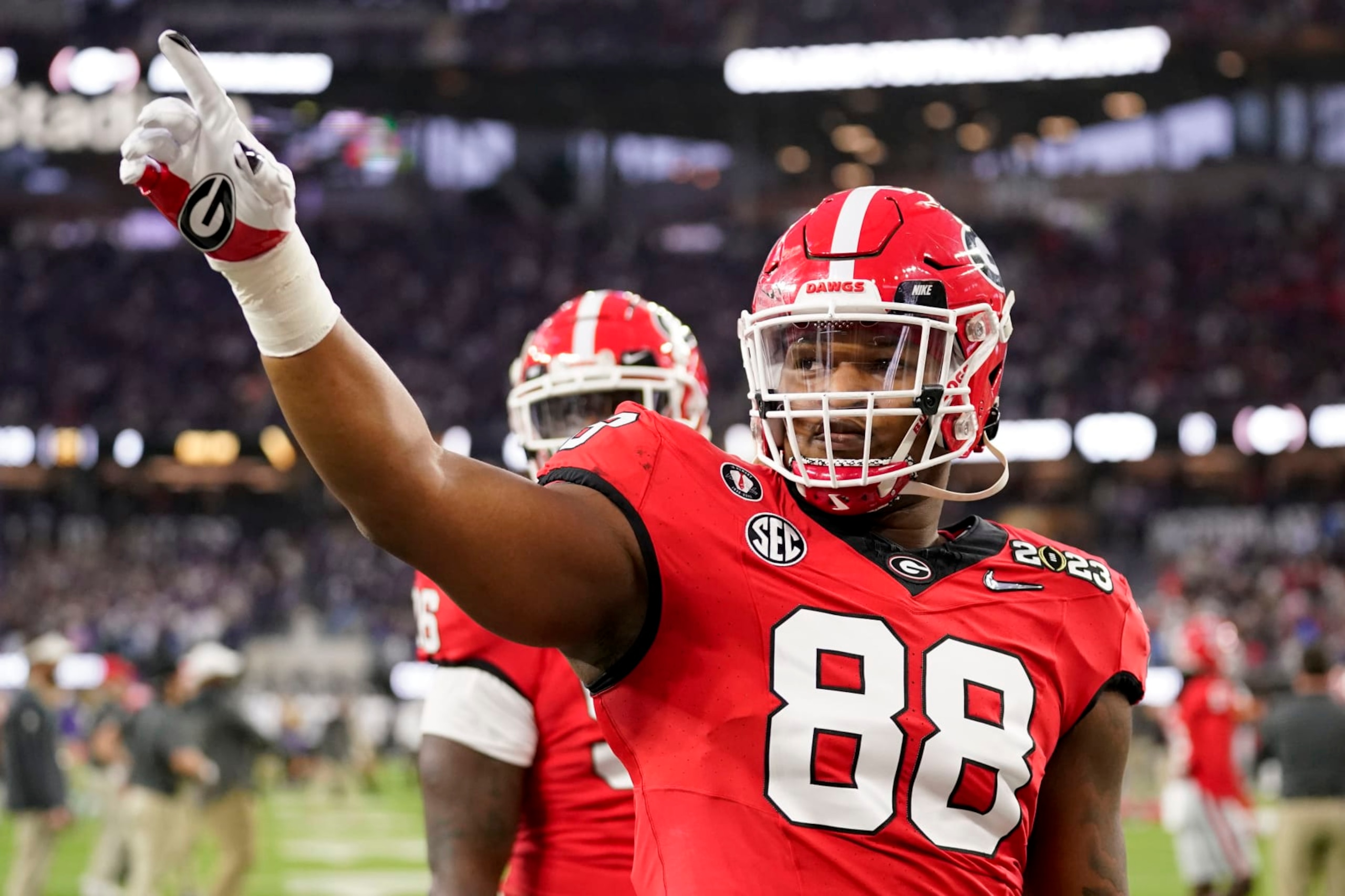 Georgia defensive lineman Jalen Carter (88) waves to the crowd before the national championship NCAA College Football Playoff game between Georgia and TCU, Monday, Jan. 9, 2023, in Inglewood, Calif. (AP Photo/Ashley Landis)