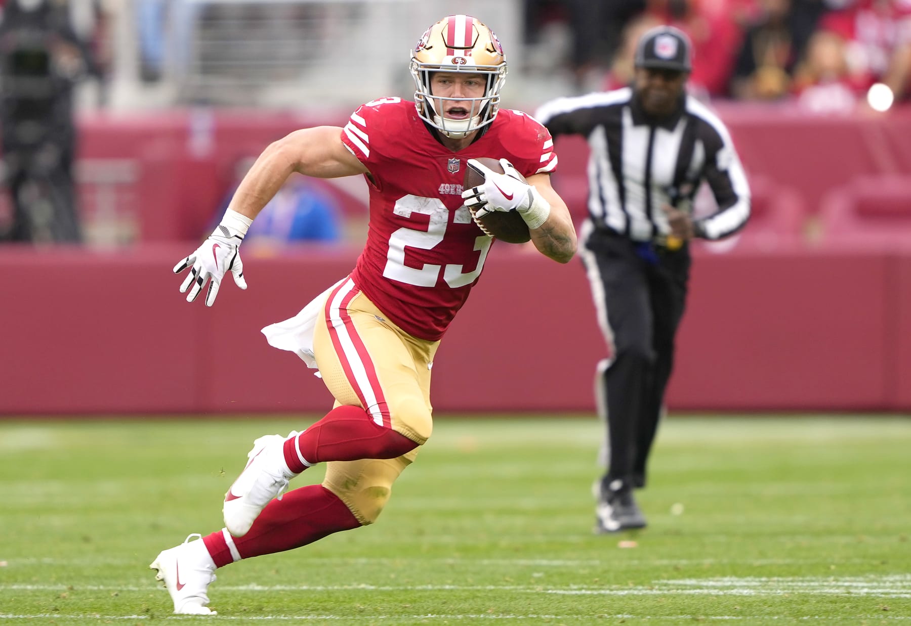 SANTA CLARA, CALIFORNIA - JANUARY 08: Christian McCaffery #23 of the San Francisco 49ers carries the ball against the Arizona Cardinals during the third quarter of an NFL football game at Levi's Stadium on January 08, 2023 in Santa Clara, California. (Photo by Thearon W. Henderson/Getty Images)
