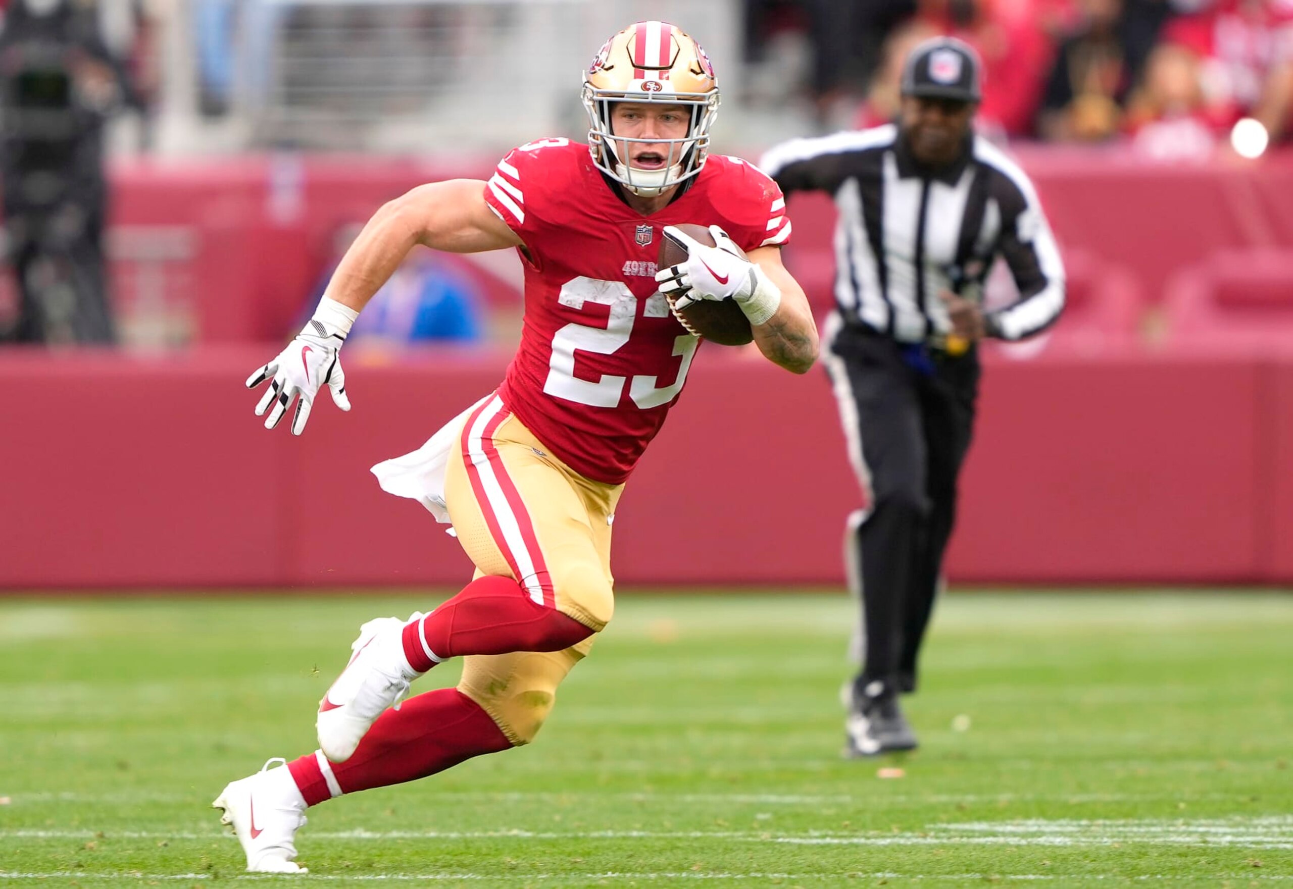 SANTA CLARA, CALIFORNIA - JANUARY 08: Christian McCaffery #23 of the San Francisco 49ers carries the ball against the Arizona Cardinals during the third quarter of an NFL football game at Levi's Stadium on January 08, 2023 in Santa Clara, California. (Photo by Thearon W. Henderson/Getty Images)