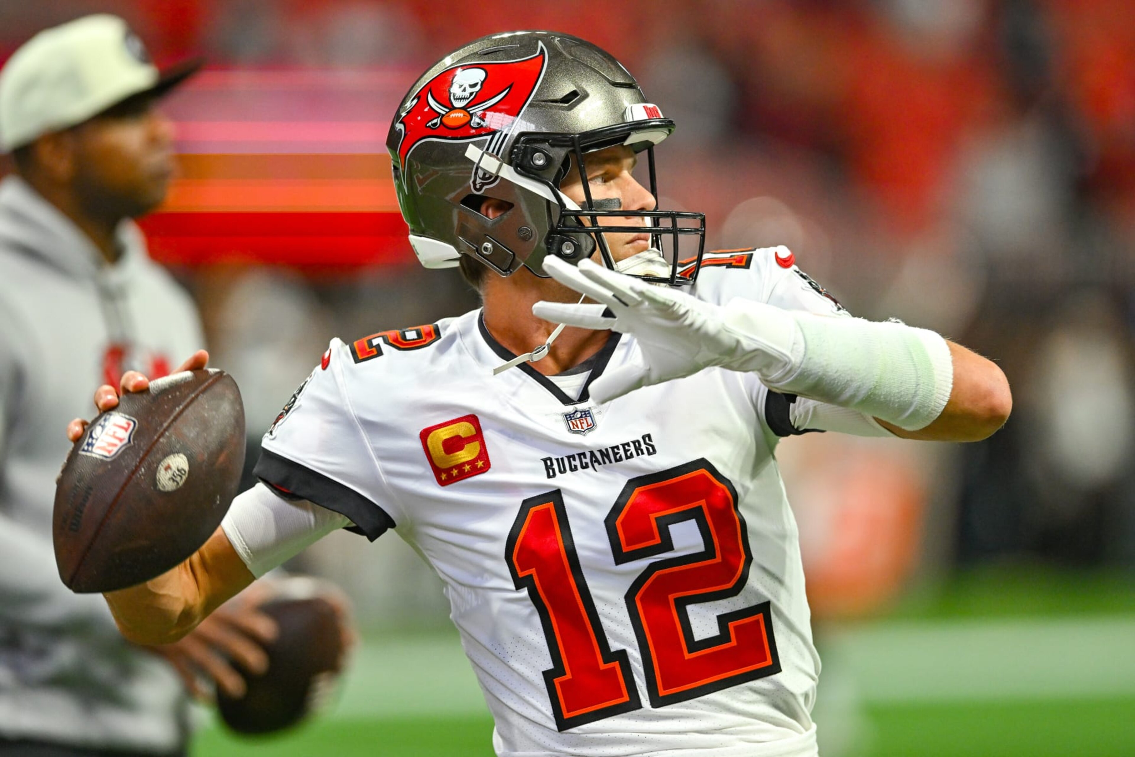 ATLANTA, GA JANUARY 08: Tampa Bay quarterback Tom Brady (12) warms up prior to the start of the NFL game between the Tampa Bay Buccaneers and the Atlanta Falcons on January 8th, 2023 at Mercedes-Benz Stadium in Atlanta, GA. (Photo by Rich von Biberstein/Icon Sportswire via Getty Images) ATLANTA, GA JANUARY 08: Tampa Bay quarterback Tom Brady (12) warms up prior to the start of the NFL game between the Tampa Bay Buccaneers and the Atlanta Falcons on January 8th, 2023 at Mercedes-Benz Stadium in Atlanta, GA. (Photo by Rich von Biberstein/Icon Sportswire via Getty Images)