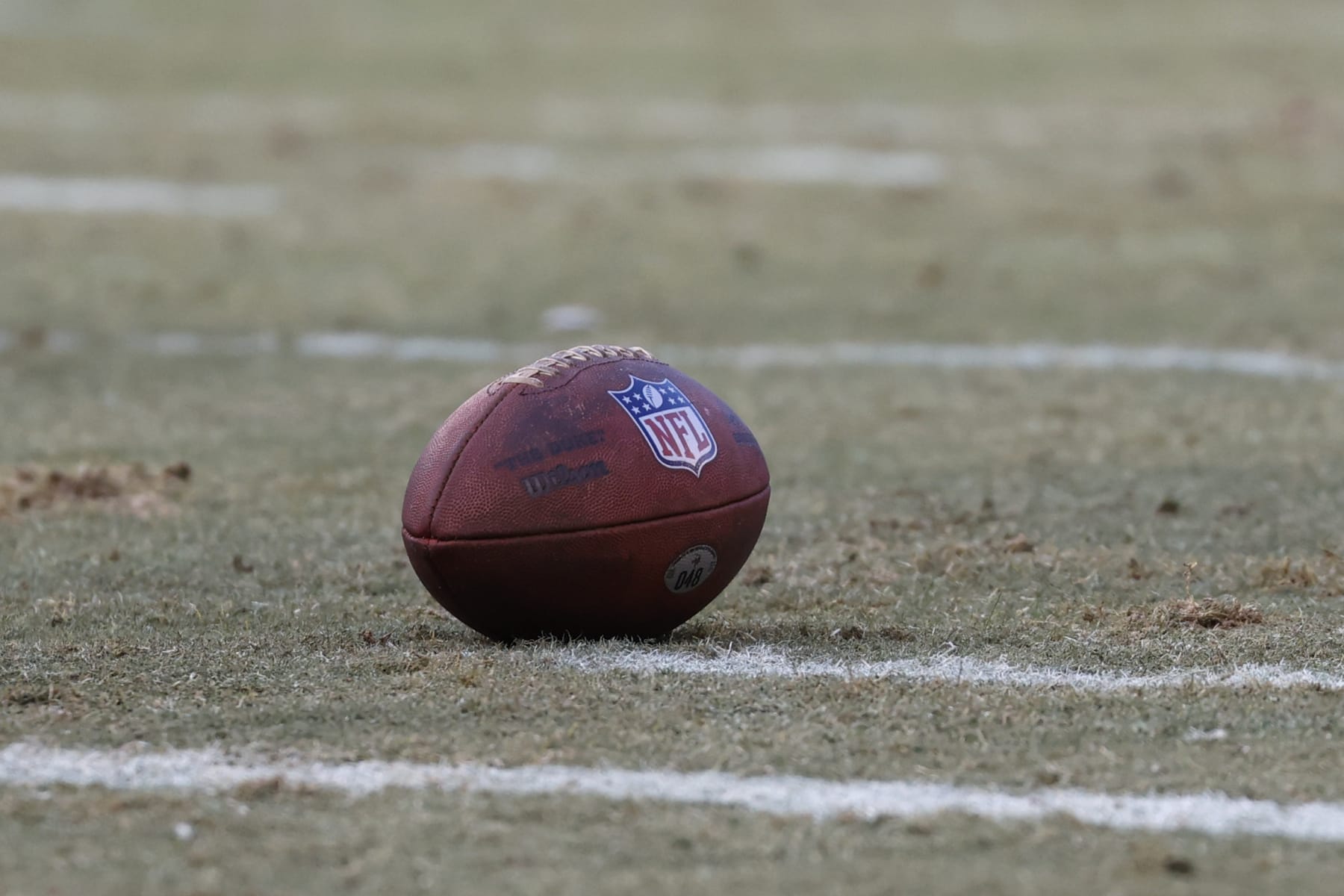 Wilson football sits on the field during the first half of an NFL football game between the Chicago Bears and Minnesota Vikings, Sunday, Jan. 8, 2023, in Chicago. (AP Photo/Kamil Krzaczynski)
