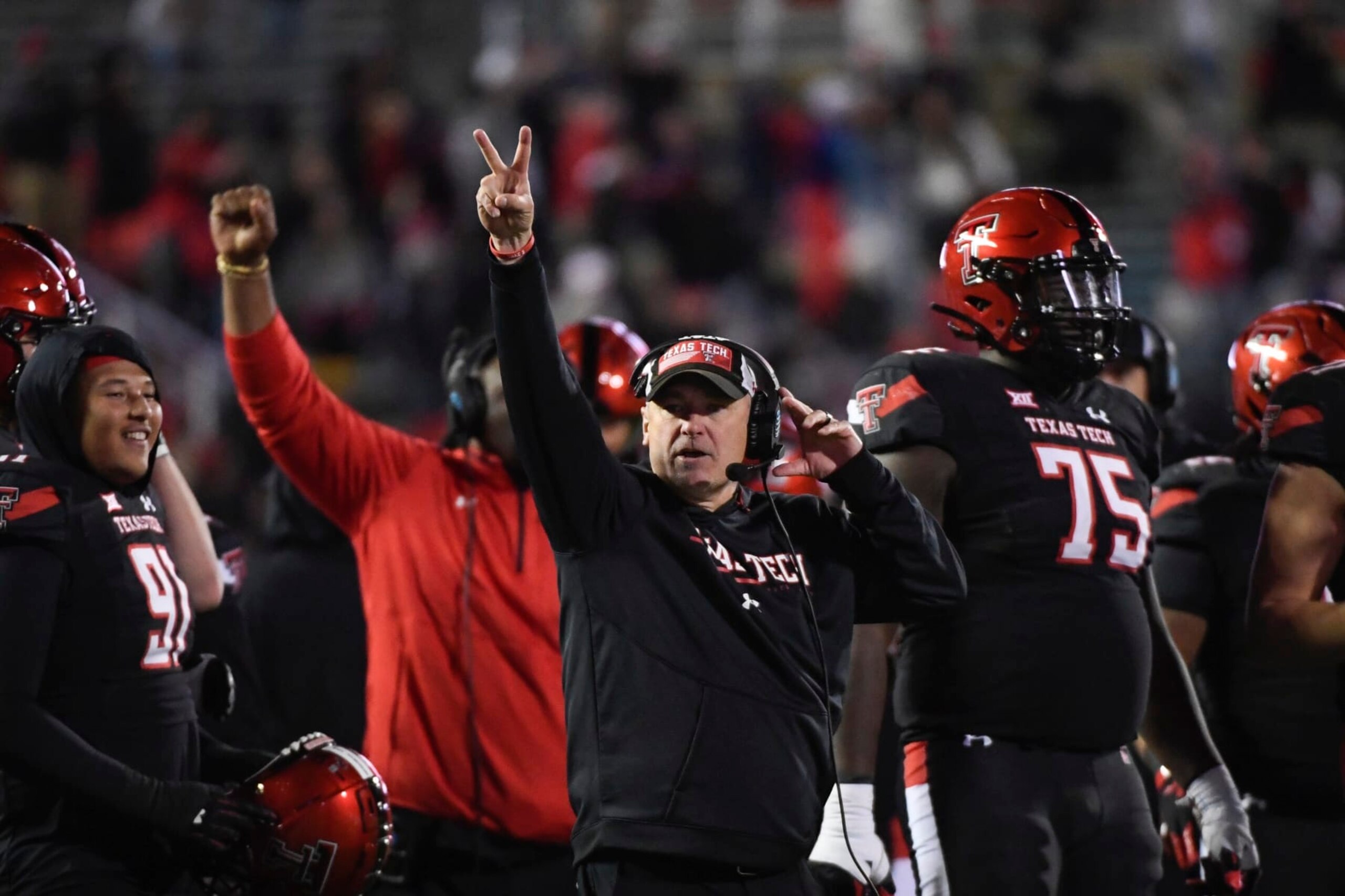 Texas Tech head coach Joey McGuire signals players against Kansas during the second half of an NCAA college football game Saturday, Nov. 12, 2022, in Lubbock, Texas. (AP Photo/Justin Rex)