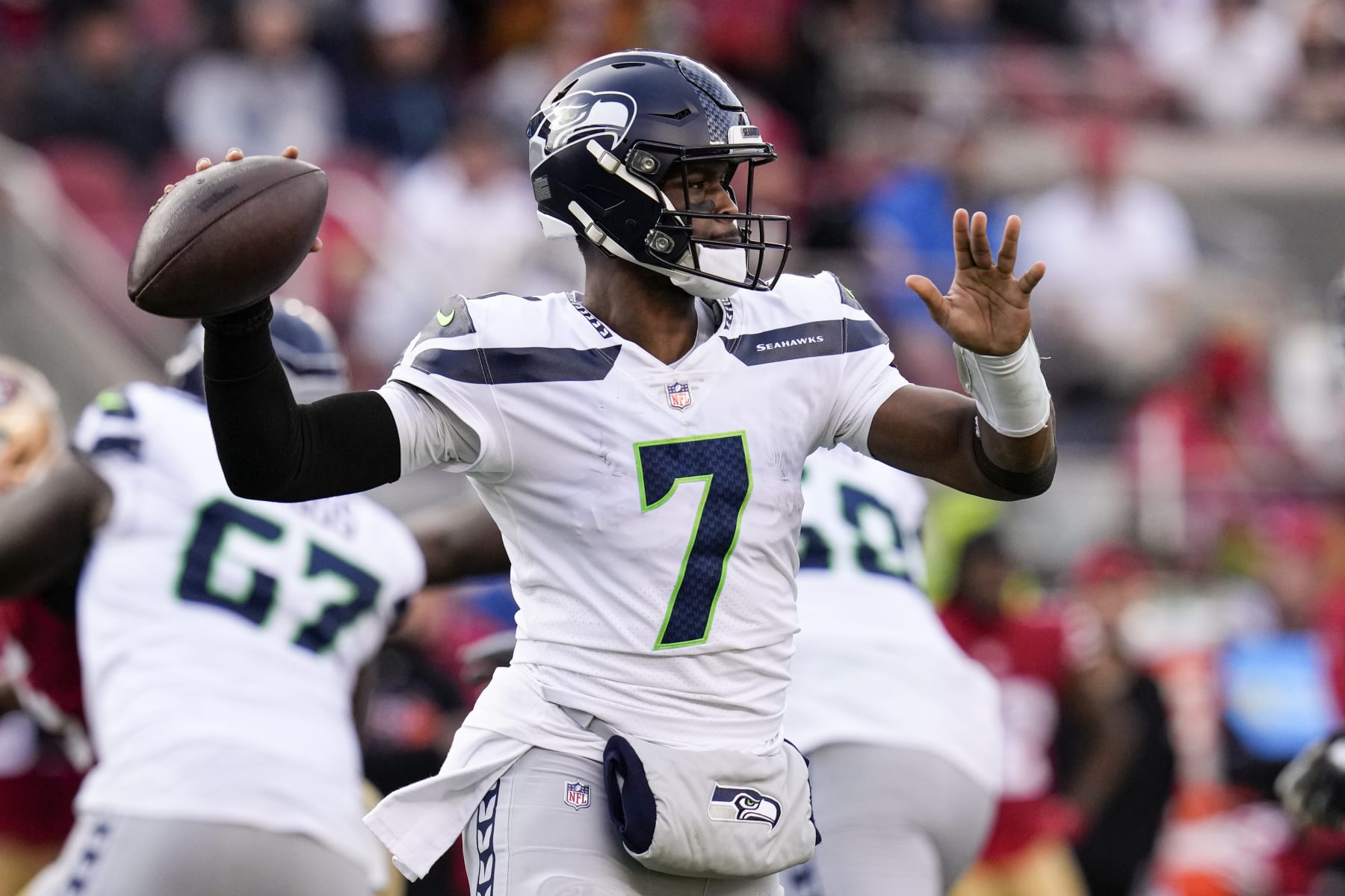 Seattle Seahawks quarterback Geno Smith (7) passes against the San Francisco 49ers during the first half of an NFL wild card playoff football game in Santa Clara, Calif., Saturday, Jan. 14, 2023. (AP Photo/Godofredo A. Vásquez)