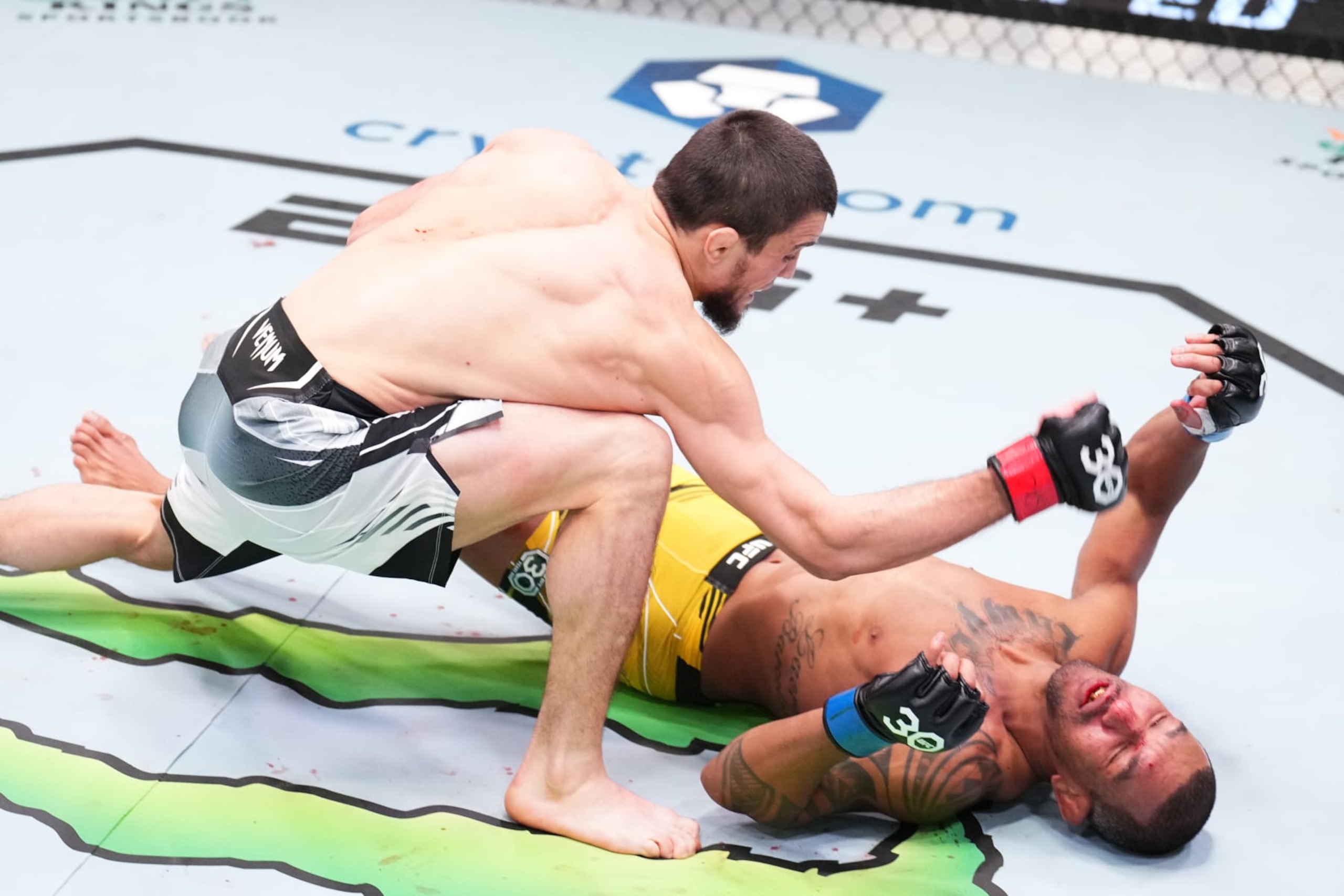 LAS VEGAS, NEVADA - JANUARY 14: (L-R) Umar Nurmagomedov of Russia knocks out Raoni Barcelos of Brazil in a bantamweight fight during the UFC Fight Night event at UFC APEX on January 14, 2023 in Las Vegas, Nevada. (Photo by Chris Unger/Zuffa LLC via Getty Images)