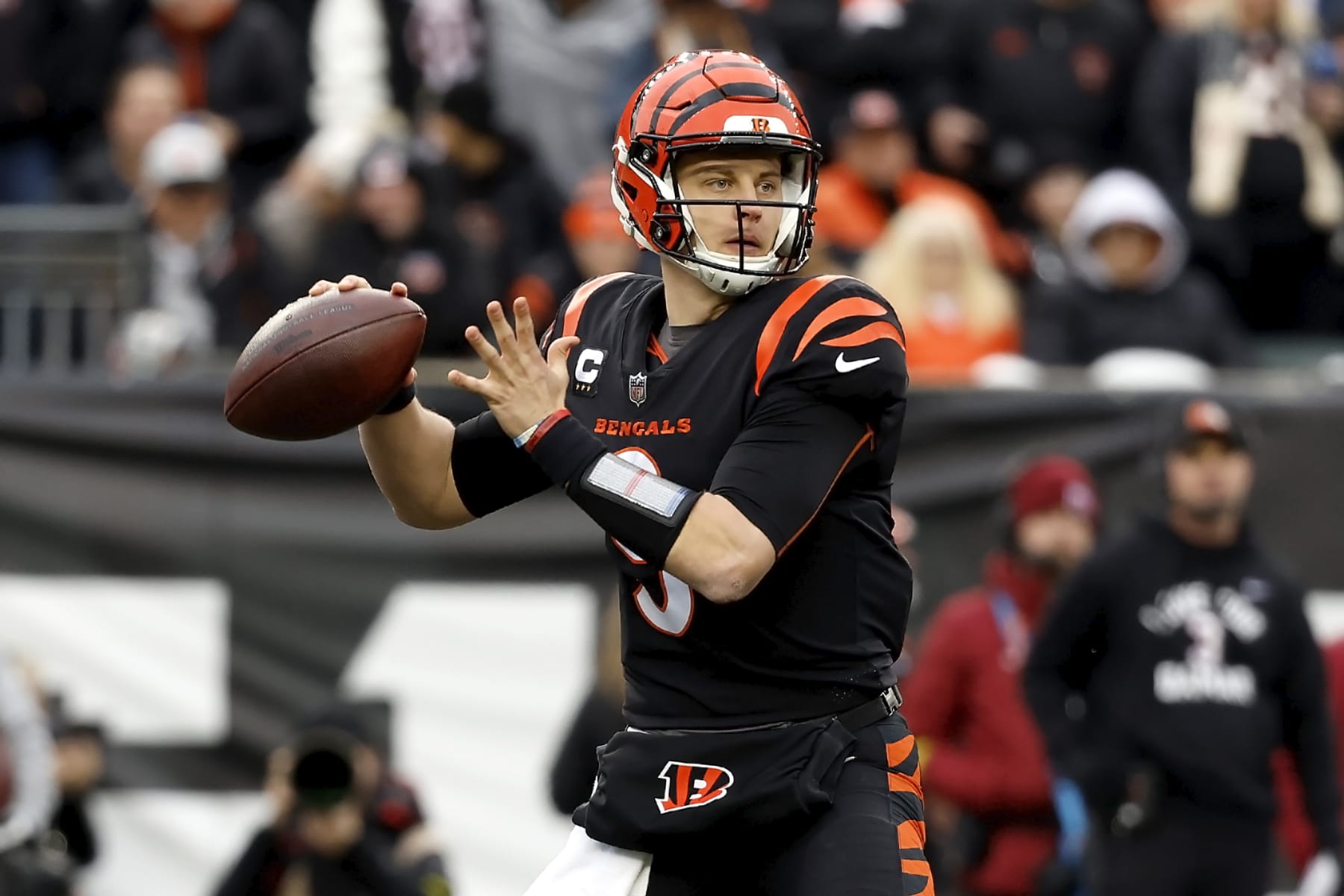 CINCINNATI, OH - JANUARY 08:  Joe Burrow #9 of the Cincinnati Bengals throws the ball during the game against the Baltimore Ravens at Paycor Stadium on January 8, 2023 in Cincinnati, Ohio. (Photo by Kirk Irwin/Getty Images)