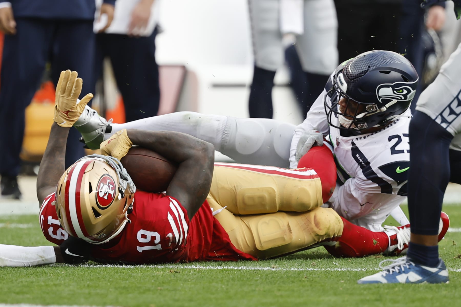 Seattle Seahawks safety Johnathan Abram (23) tackles San Francisco 49ers wide receiver Deebo Samuel (19) during the second half of an NFL wild card playoff football game in Santa Clara, Calif., Saturday, Jan. 14, 2023. (AP Photo/Josie Lepe)