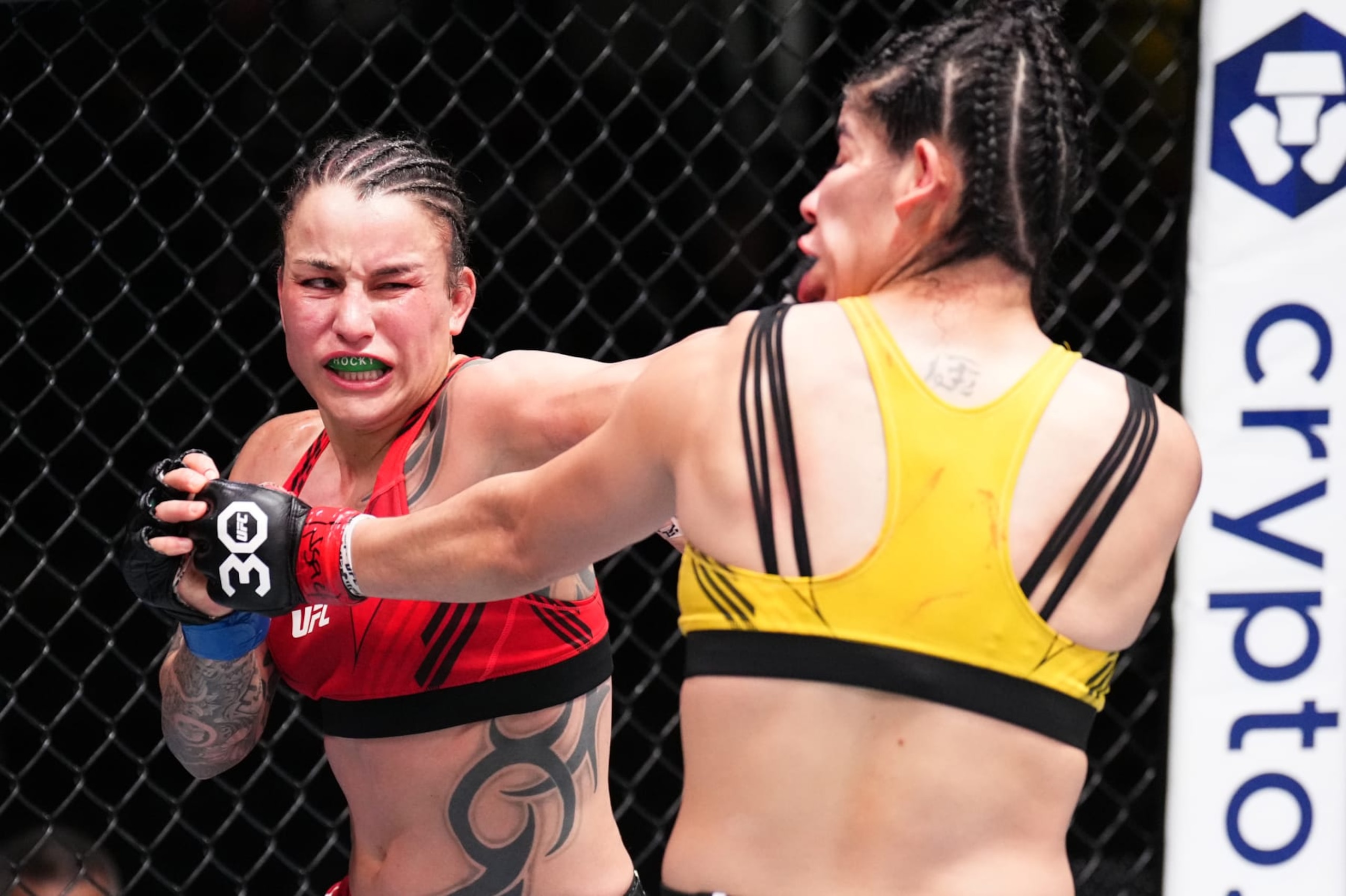 LAS VEGAS, NEVADA - JANUARY 14: (L-R) Raquel Pennington punches Ketlen Vieira of Brazil in a bantamweight fight during the UFC Fight Night event at UFC APEX on January 14, 2023 in Las Vegas, Nevada. (Photo by Chris Unger/Zuffa LLC via Getty Images)