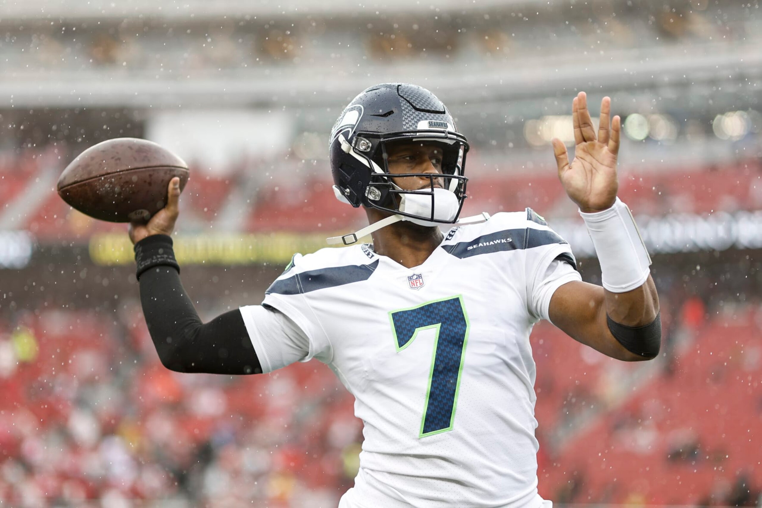 SANTA CLARA, CALIFORNIA - JANUARY 14: Geno Smith #7 of the Seattle Seahawks passes as he warms up prior to an NFL football game between the San Francisco 49ers and the Seattle Seahawks at Levi's Stadium on January 14, 2023 in Santa Clara, California. (Photo by Michael Owens/Getty Images) SANTA CLARA, CALIFORNIA - JANUARY 14: Geno Smith #7 of the Seattle Seahawks passes as he warms up prior to an NFL football game between the San Francisco 49ers and the Seattle Seahawks at Levi's Stadium on January 14, 2023 in Santa Clara, California. (Photo by Michael Owens/Getty Images)