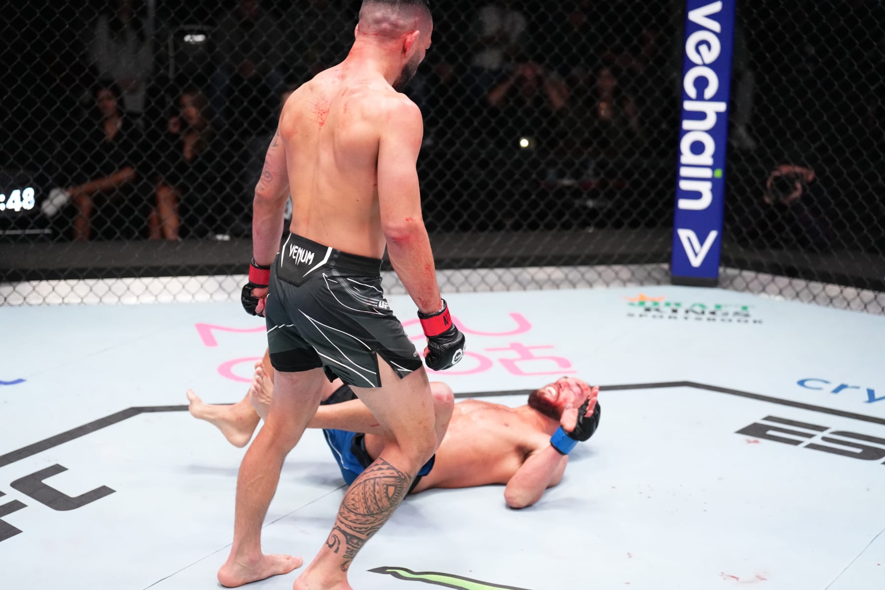 LAS VEGAS, NEVADA - JANUARY 14: (L-R) Dan Ige knocks out Damon Jackson in a featherweight fight during the UFC Fight Night event at UFC APEX on January 14, 2023 in Las Vegas, Nevada. (Photo by Chris Unger/Zuffa LLC via Getty Images)