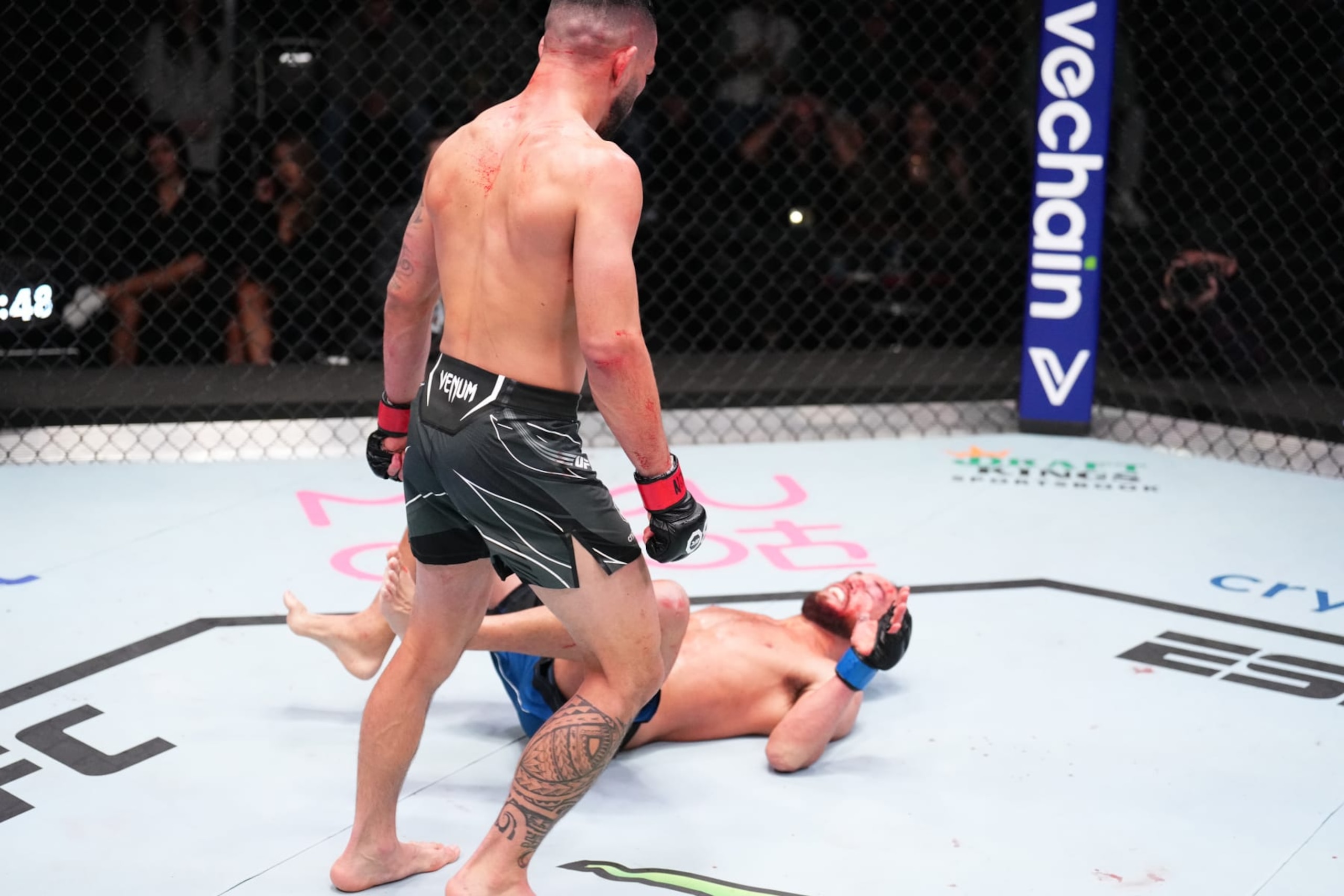 LAS VEGAS, NEVADA - JANUARY 14: (L-R) Dan Ige knocks out Damon Jackson in a featherweight fight during the UFC Fight Night event at UFC APEX on January 14, 2023 in Las Vegas, Nevada. (Photo by Chris Unger/Zuffa LLC via Getty Images)