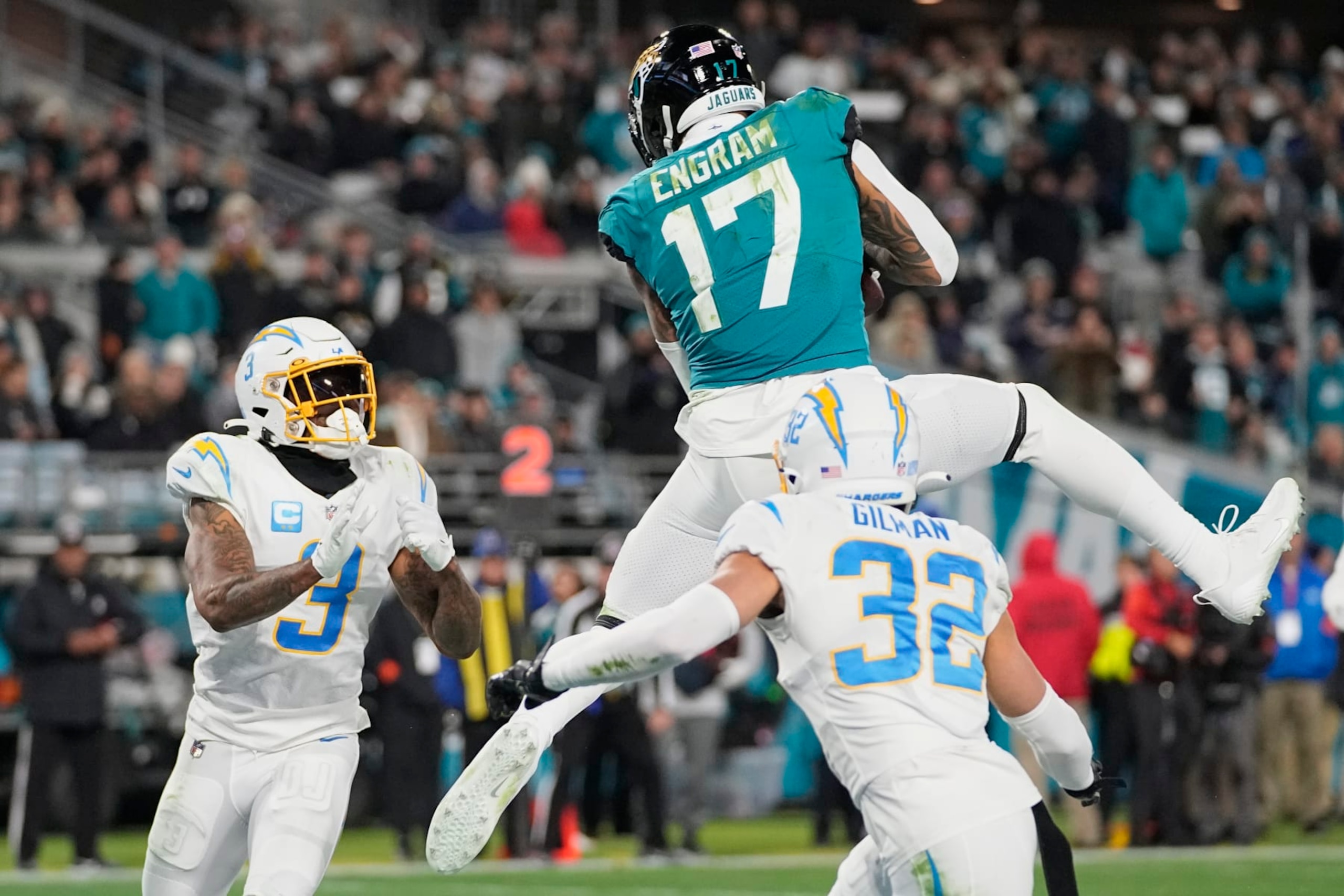 Jacksonville Jaguars tight end Evan Engram (17) makes the catch for a touchdown against the Los Angeles Chargers during the first half of an NFL wild-card football game, Saturday, Jan. 14, 2023, in Jacksonville, Fla. (AP Photo/Chris Carlson)