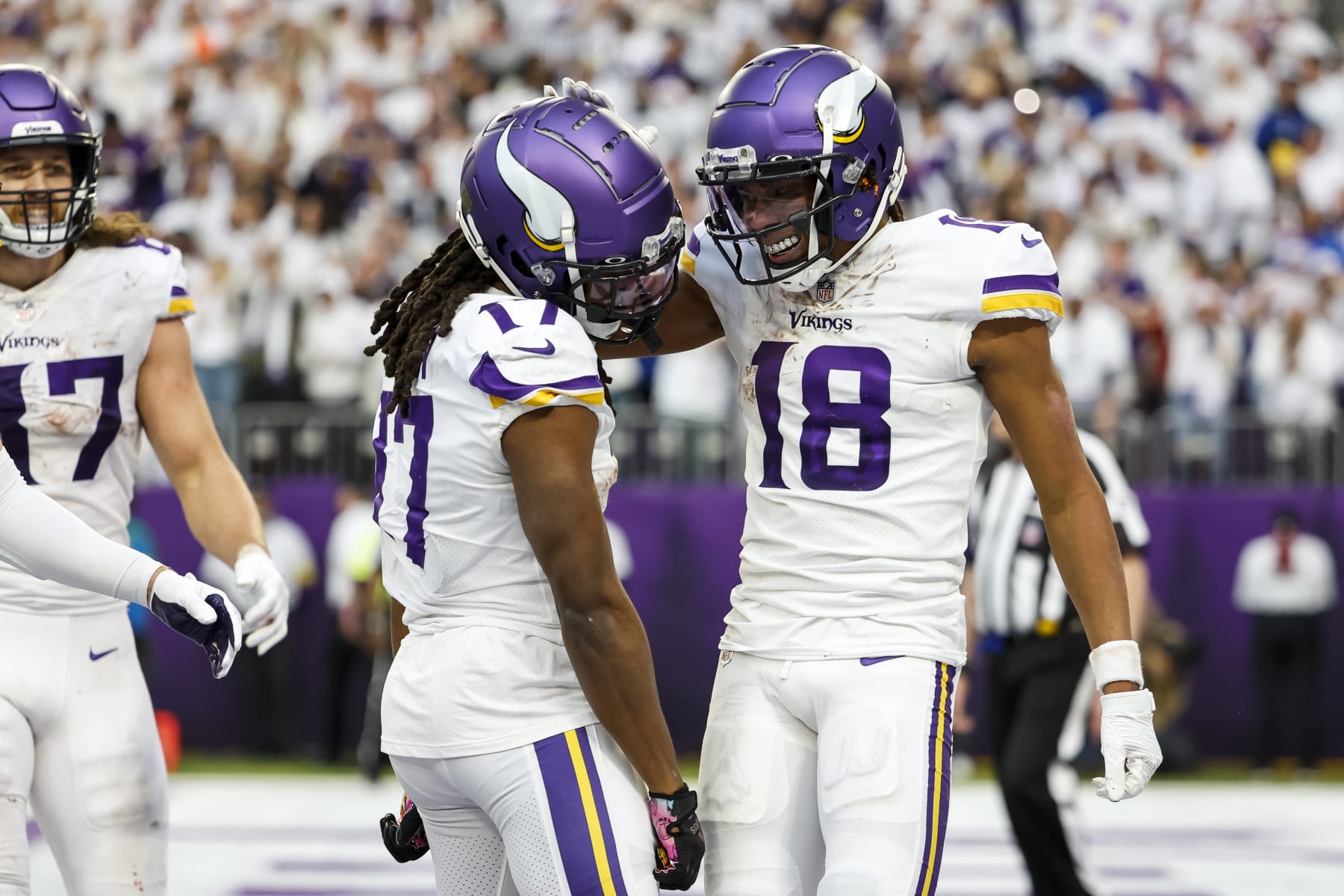 MINNEAPOLIS, MN - DECEMBER 24: Justin Jefferson #18 of the Minnesota Vikings celebrates his touchdown against the New York Giants with teammate K.J. Osborn #17 in the fourth quarter of the game at U.S. Bank Stadium on December 24, 2022 in Minneapolis, Minnesota. The Vikings defeated the Giants 27-24. (Photo by David Berding/Getty Images)