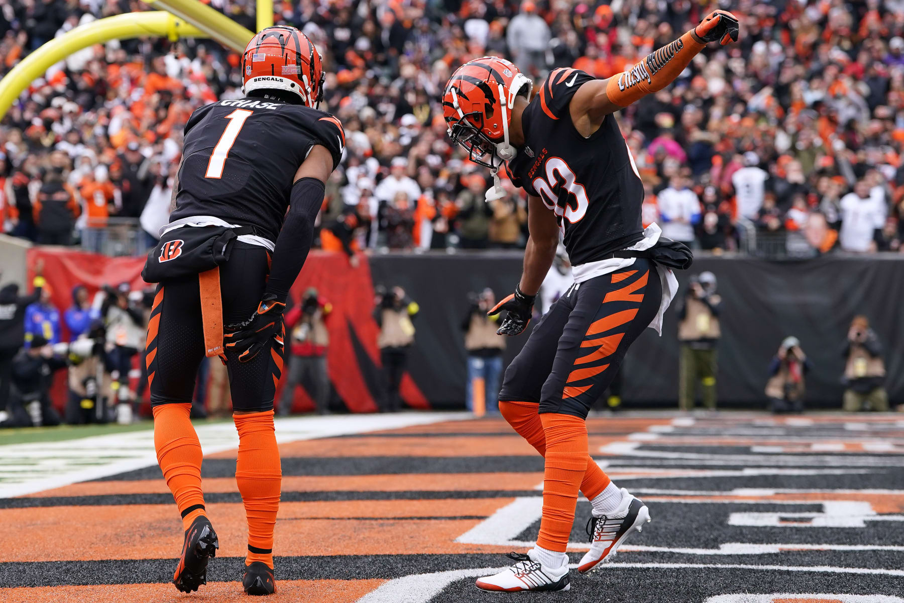 CINCINNATI, OHIO - JANUARY 08: Ja'Marr Chase #1 of the Cincinnati Bengals celebrates his touchdown catch with Tyler Boyd #83 during the second quarter against the Baltimore Ravens at Paycor Stadium on January 08, 2023 in Cincinnati, Ohio. (Photo by Dylan Buell/Getty Images)