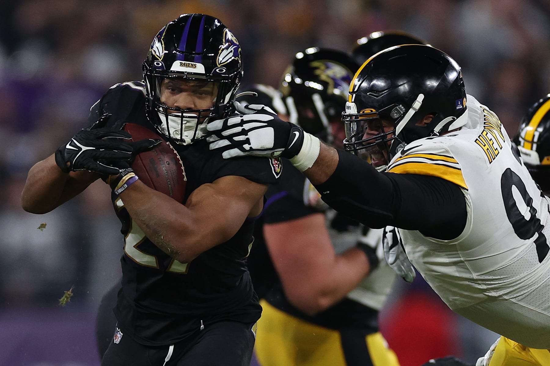 BALTIMORE, MARYLAND - JANUARY 01: J.K. Dobbins #27 of the Baltimore Ravens breaks a tackle from Cameron Heyward #97 of the Pittsburgh Steelers during the first quarter at M&T Bank Stadium on January 01, 2023 in Baltimore, Maryland. (Photo by Patrick Smith/Getty Images)
