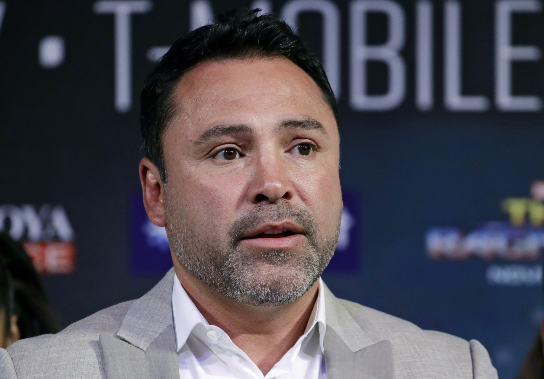 FILE - In this Sept. 13, 2017 file photo, Oscar de la Hoya speaks during a news conference in Las Vegas. De La Hoya denies accusations of sexual assault contained in a lawsuit filed against him this week. The boxing promoter's company, Golden Boy Promotions, issued a statement Tuesday, Oct. 22, 2019, describing the action as a "frivolous lawsuit" and calling the allegations "completely false." (AP Photo/John Locher, File)