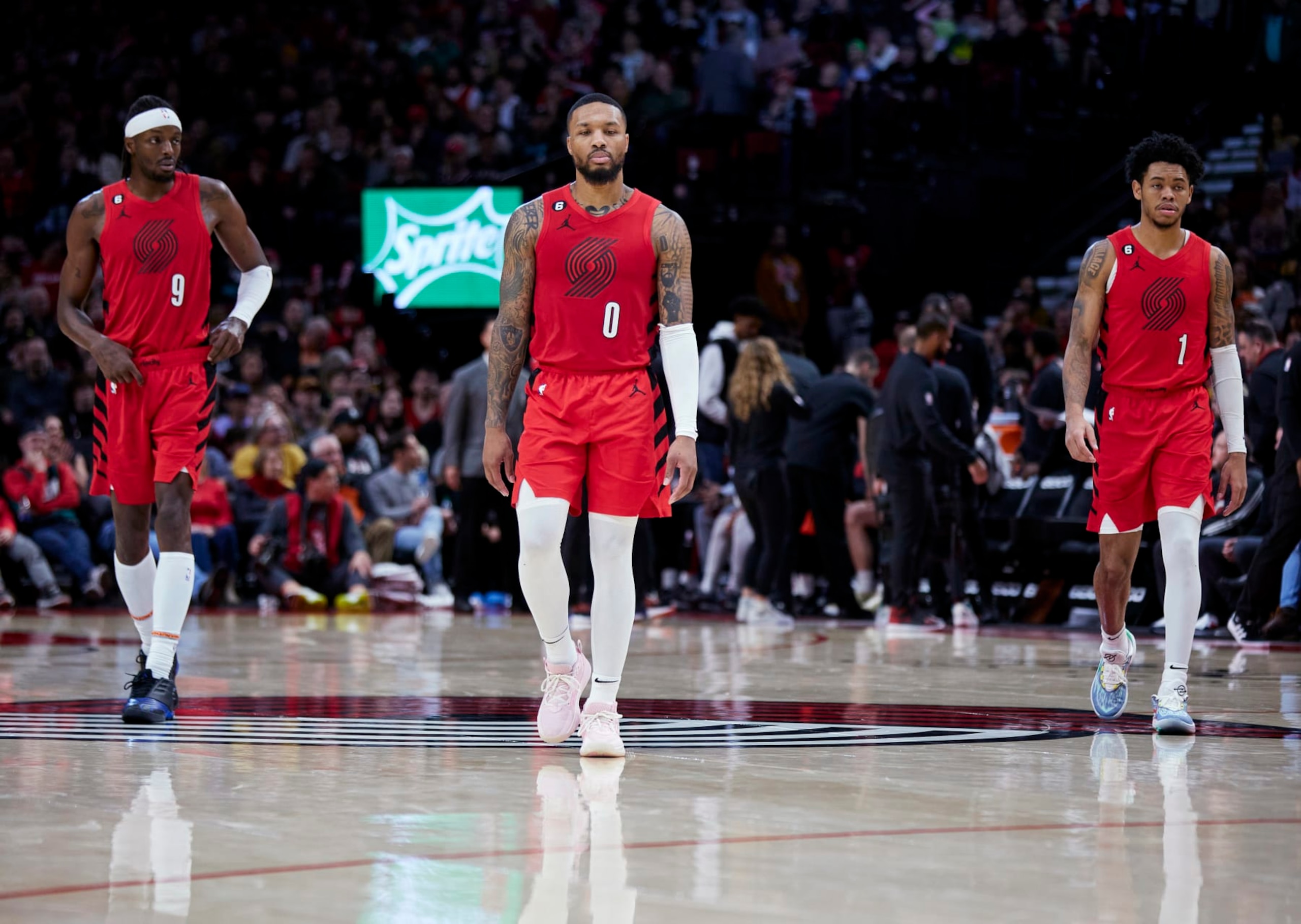 (L-R) Jerami Grant, Damian Lillard and Anfernee Simons