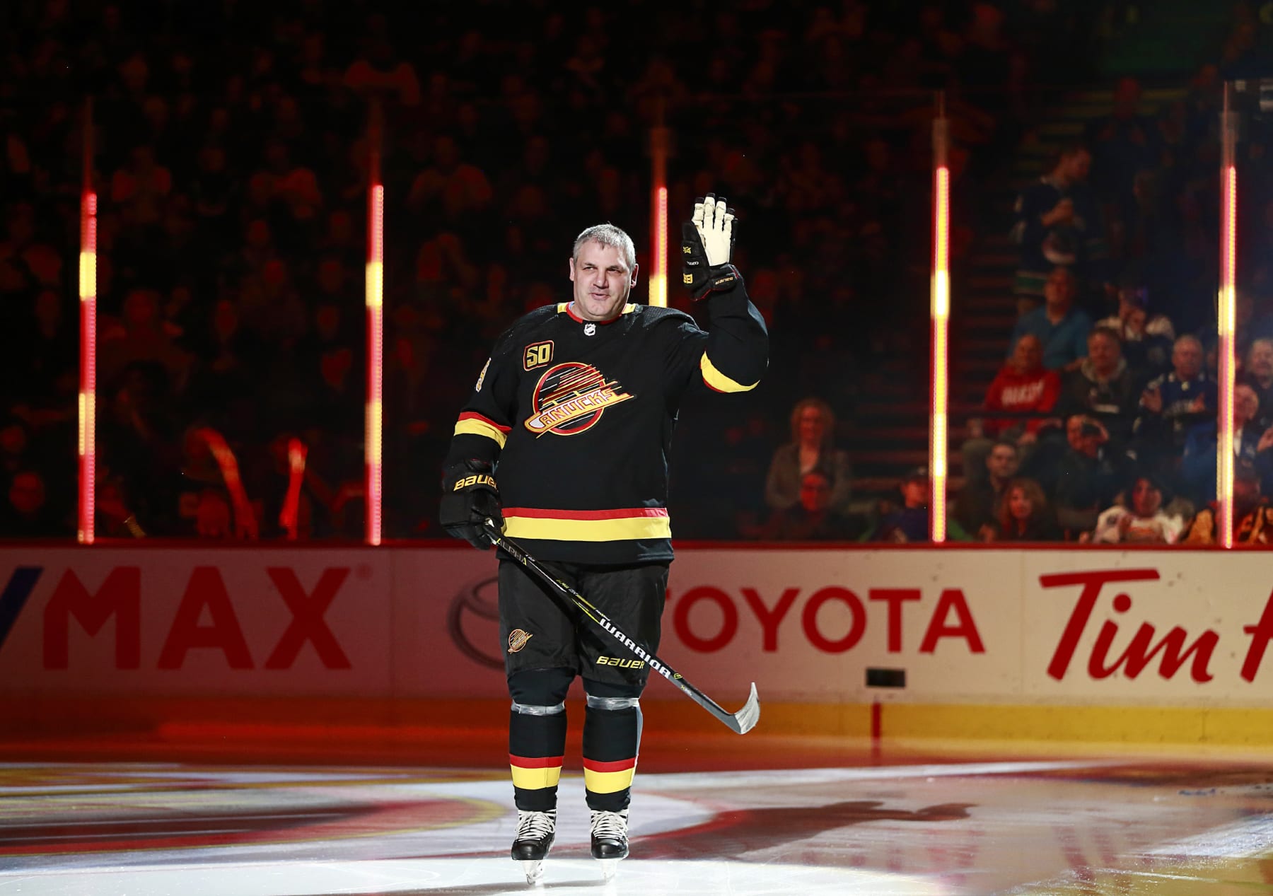 VANCOUVER, BC - JANUARY 4: Former Vancouver Canuck Gino Odjick skates up ice during an NHL game against the New York Rangers at Rogers Arena January 4, 2020 in Vancouver, British Columbia, Canada.  (Photo by Jeff Vinnick/NHLI via Getty Images)"n