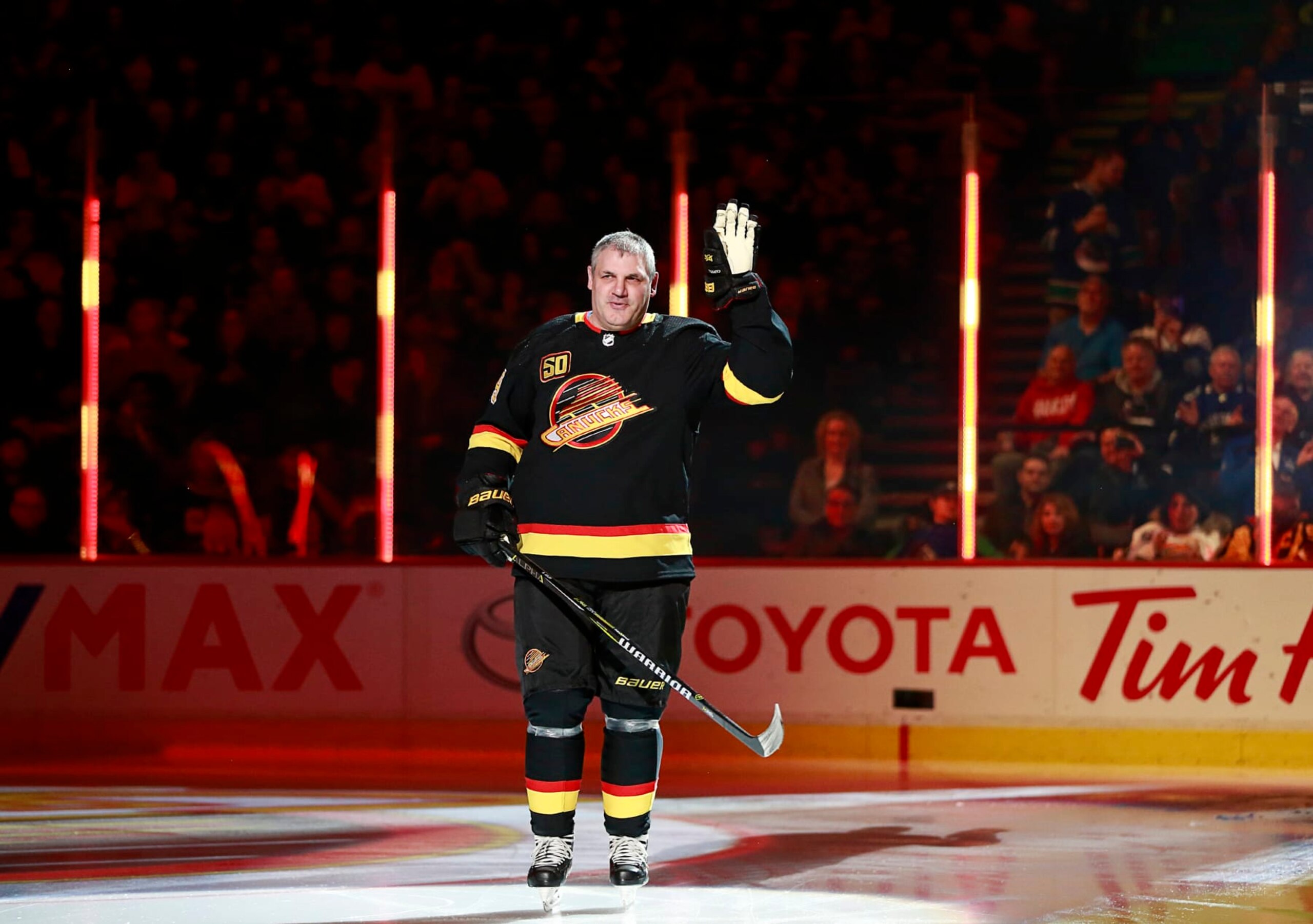 VANCOUVER, BC - JANUARY 4: Former Vancouver Canuck Gino Odjick skates up ice during an NHL game against the New York Rangers at Rogers Arena January 4, 2020 in Vancouver, British Columbia, Canada.  (Photo by Jeff Vinnick/NHLI via Getty Images)"n