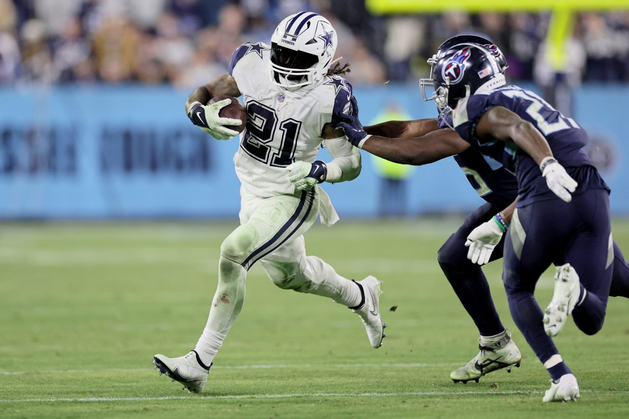 NASHVILLE, TENNESSEE - DECEMBER 29: Ezekiel Elliott #21 of the Dallas Cowboys runs the ball against the Tennessee Titans during the fourth quarter of the game at Nissan Stadium on December 29, 2022 in Nashville, Tennessee. (Photo by Andy Lyons/Getty Images) NASHVILLE, TENNESSEE - DECEMBER 29: Ezekiel Elliott #21 of the Dallas Cowboys runs the ball against the Tennessee Titans during the fourth quarter of the game at Nissan Stadium on December 29, 2022 in Nashville, Tennessee. (Photo by Andy Lyons/Getty Images)