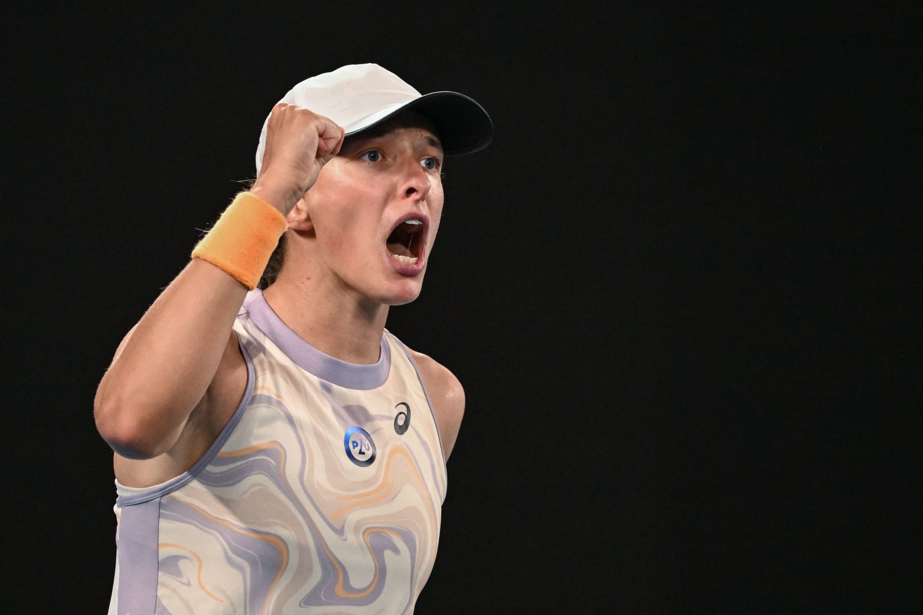 Poland's Iga Swiatek celebrates after winning against Germany's Jule Niemeier during their women's singles match on day one of the Australian Open tennis tournament in Melbourne on January 16, 2023. - -- IMAGE RESTRICTED TO EDITORIAL USE - STRICTLY NO COMMERCIAL USE -- (Photo by WILLIAM WEST / AFP) / -- IMAGE RESTRICTED TO EDITORIAL USE - STRICTLY NO COMMERCIAL USE -- (Photo by WILLIAM WEST/AFP via Getty Images)