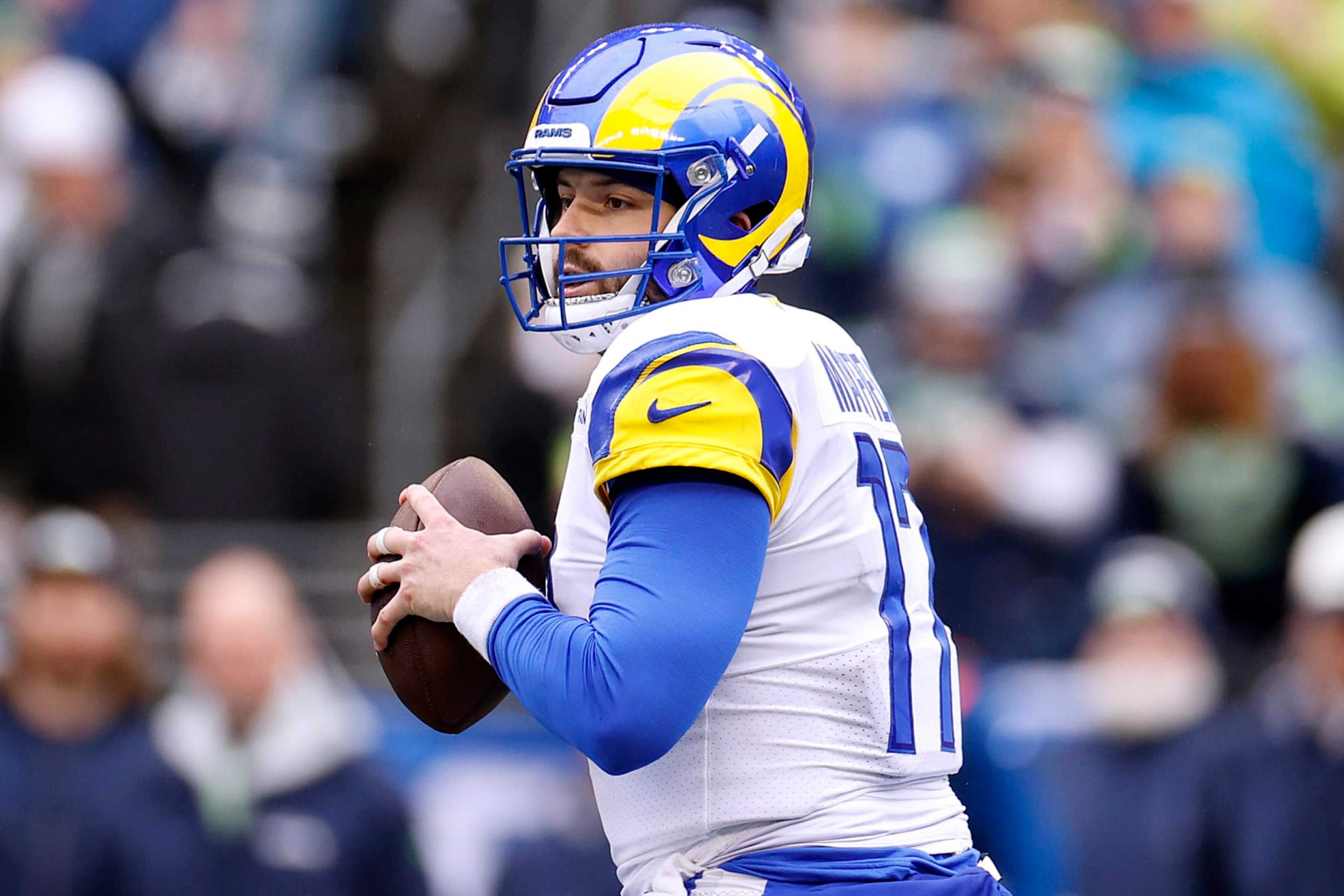 SEATTLE, WASHINGTON - JANUARY 08: Baker Mayfield #17 of the Los Angeles Rams looks to throw the ball during the first quarter against the Seattle Seahawks at Lumen Field on January 08, 2023 in Seattle, Washington. (Photo by Steph Chambers/Getty Images)