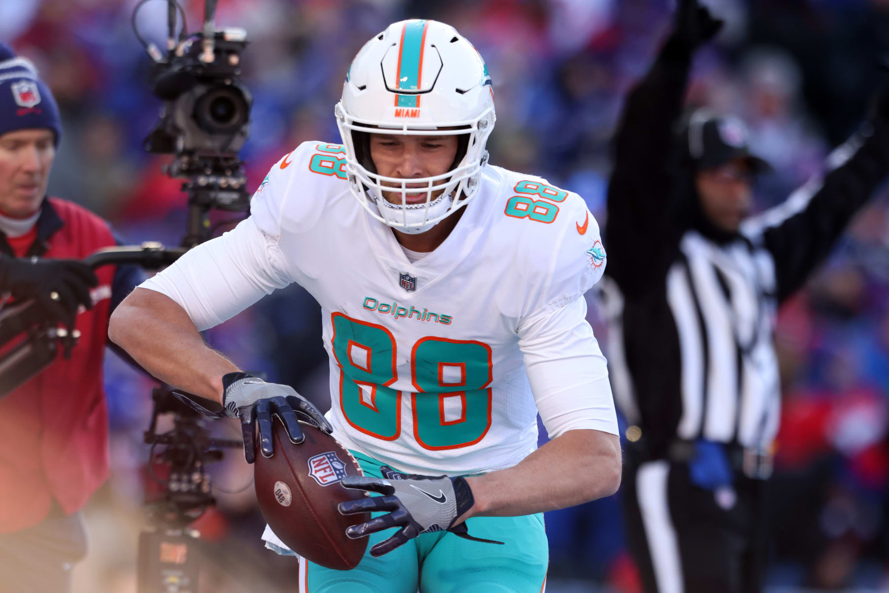 ORCHARD PARK, NEW YORK - JANUARY 15: Mike Gesicki #88 of the Miami Dolphins celebrates after scoring a touchdown during the second quarter against the Buffalo Bills in the AFC Wild Card playoff game at Highmark Stadium on January 15, 2023 in Orchard Park, New York. (Photo by Bryan M. Bennett/Getty Images)