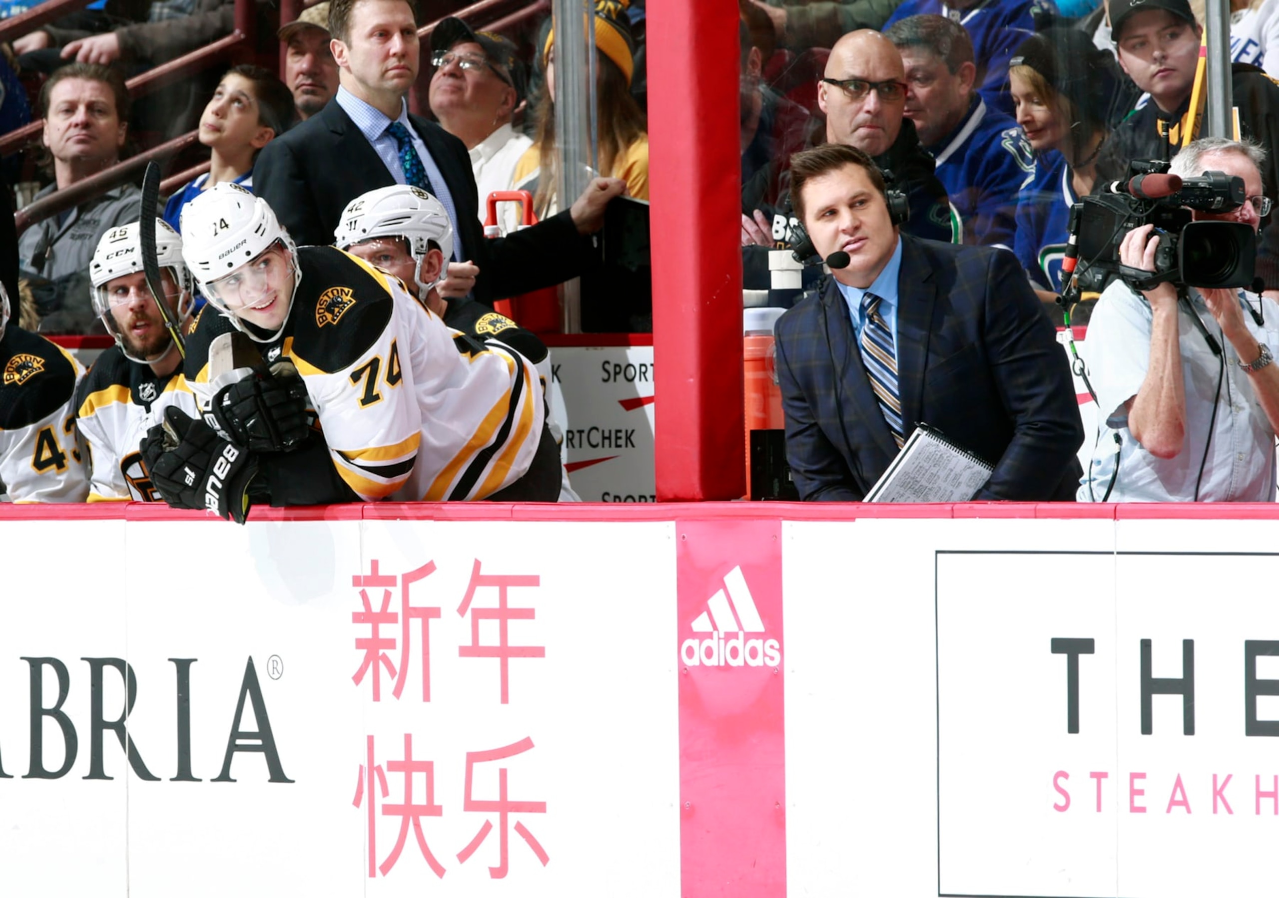 Boston Bruins winger Jake DeBrusk and his father, hockey analyst Louie DeBrusk.