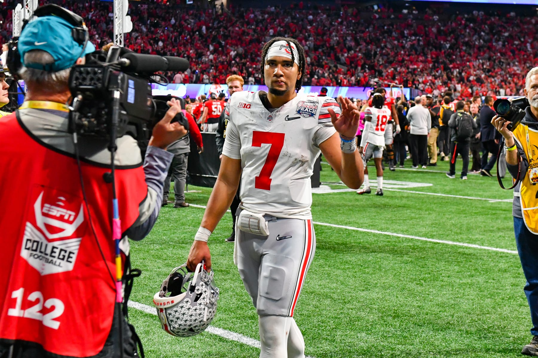 ATLANTA, GA  DECEMBER 31:  Ohio State quarterback C.J. Stroud (7) waves to the fans following the conclusion of the Chick-fil-A Peach Bowl semifinal college football playoff between the Ohio State Buckeyes and the Georgia Bulldogs on December 31st, 2022 at Mercedes-Benz Stadium in Atlanta, GA.  (Photo by Rich von Biberstein/Icon Sportswire via Getty Images)