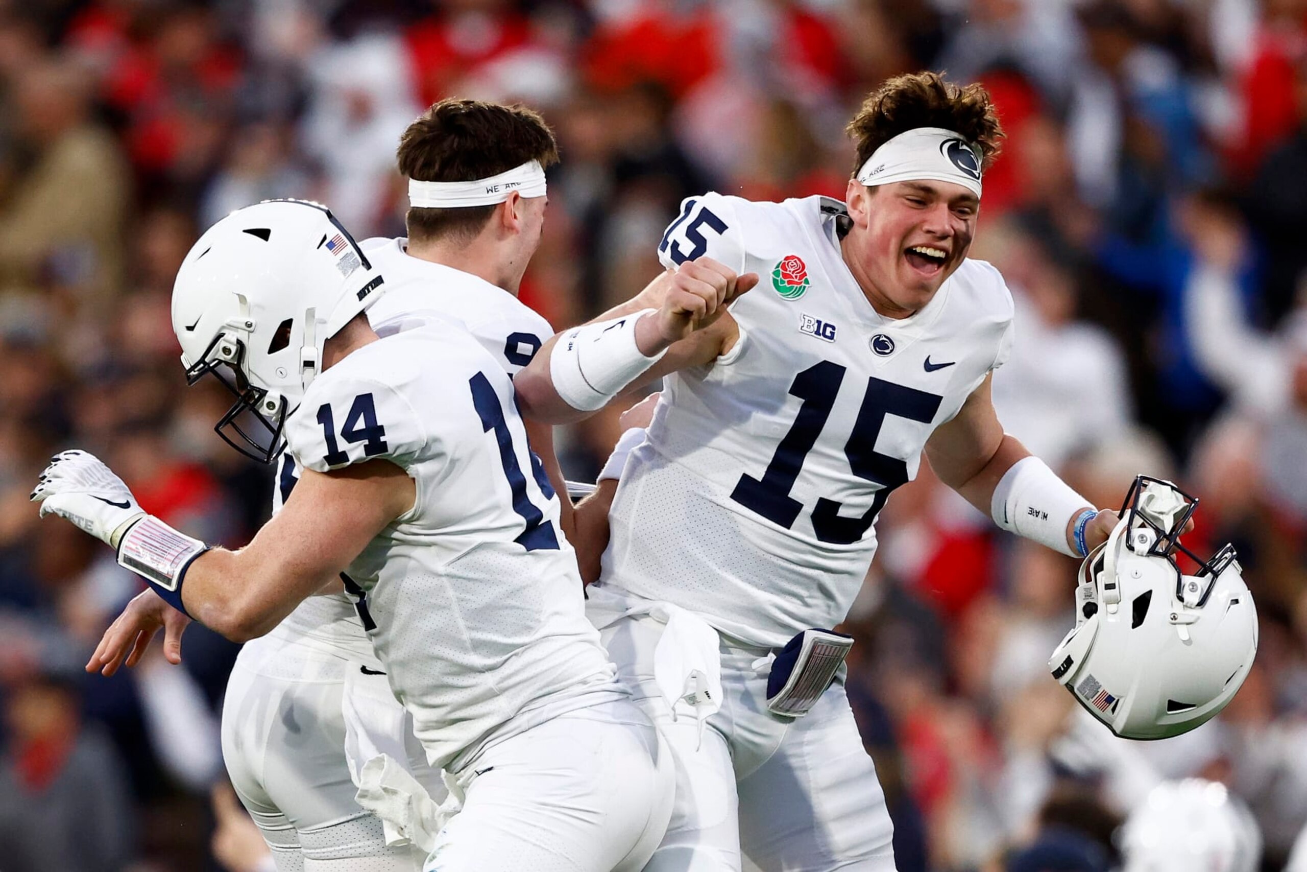 PASADENA, CALIFORNIA - JANUARY 02: Sean Clifford #14 of the Penn State Nittany Lions celebrates with Beau Pribula #9 and Drew Allar #15 after Nicholas Singleton #10 scored an 87 yard touchdown against the Utah Utes during the third quarter in the 2023 Rose Bowl Game at Rose Bowl Stadium on January 02, 2023 in Pasadena, California. (Photo by Ronald Martinez/Getty Images)
