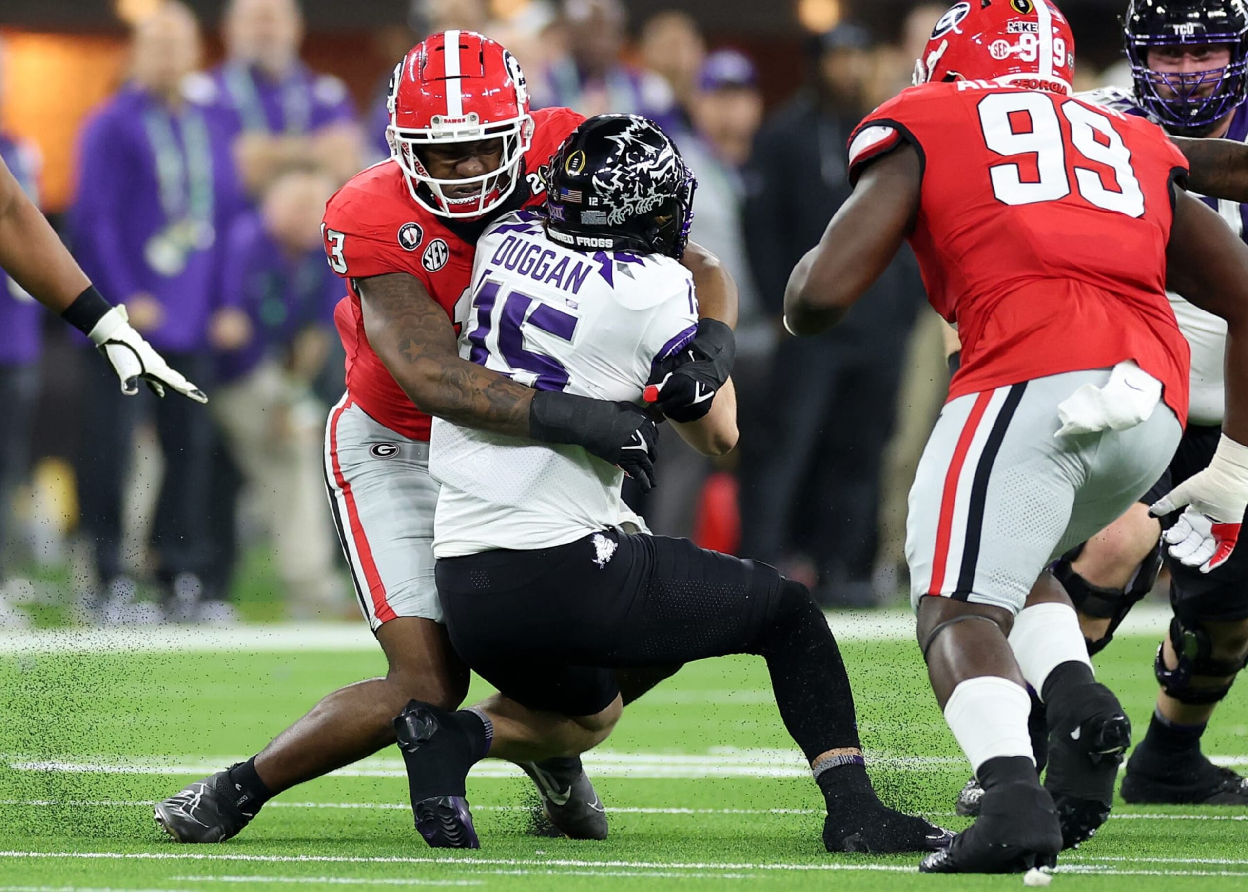 INGLEWOOD, CALIFORNIA - JANUARY 09: Mykel Williams #13 of the Georgia Bulldogs tackles Max Duggan #15 of the TCU Horned Frogs in the first quarter in the College Football Playoff National Championship game at SoFi Stadium on January 09, 2023 in Inglewood, California. (Photo by Sean M. Haffey/Getty Images)