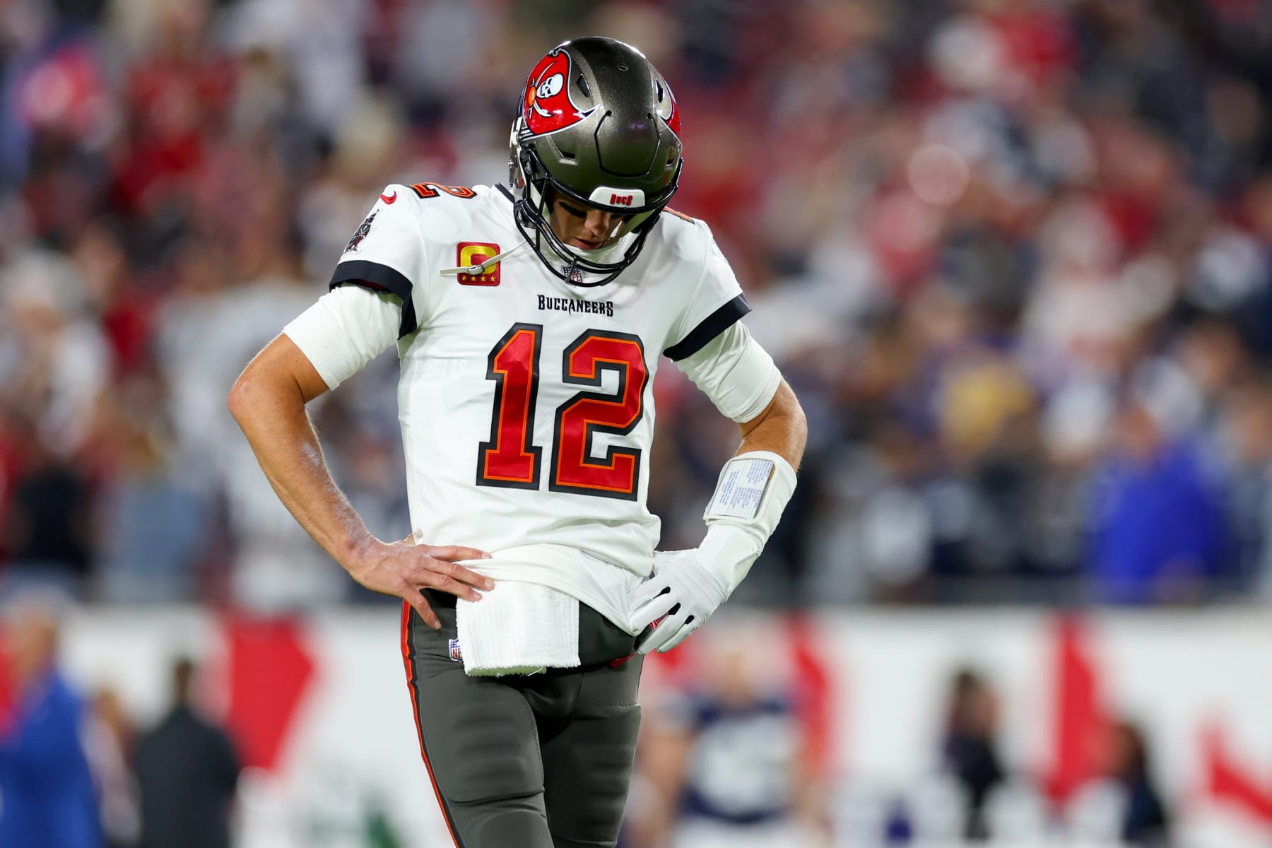 TAMPA, FLORIDA - JANUARY 16: Tom Brady #12 of the Tampa Bay Buccaneers warms up prior to a game against the Dallas Cowboys in the NFC Wild Card playoff game at Raymond James Stadium on January 16, 2023 in Tampa, Florida. (Photo by Mike Ehrmann/Getty Images)