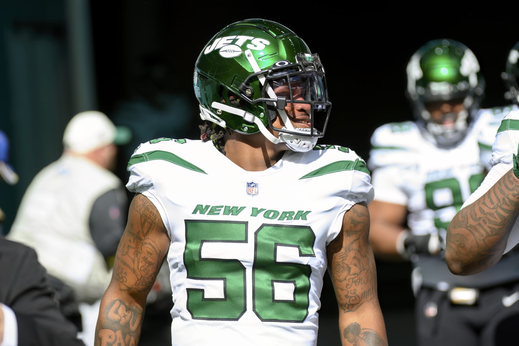 New York Jets linebacker Quincy Williams (56) walks onto the field before an NFL football game against the Miami Dolphins, Sunday, Jan. 8, 2023, in Miami Gardens, Fla. (AP Photo/Doug Murray)