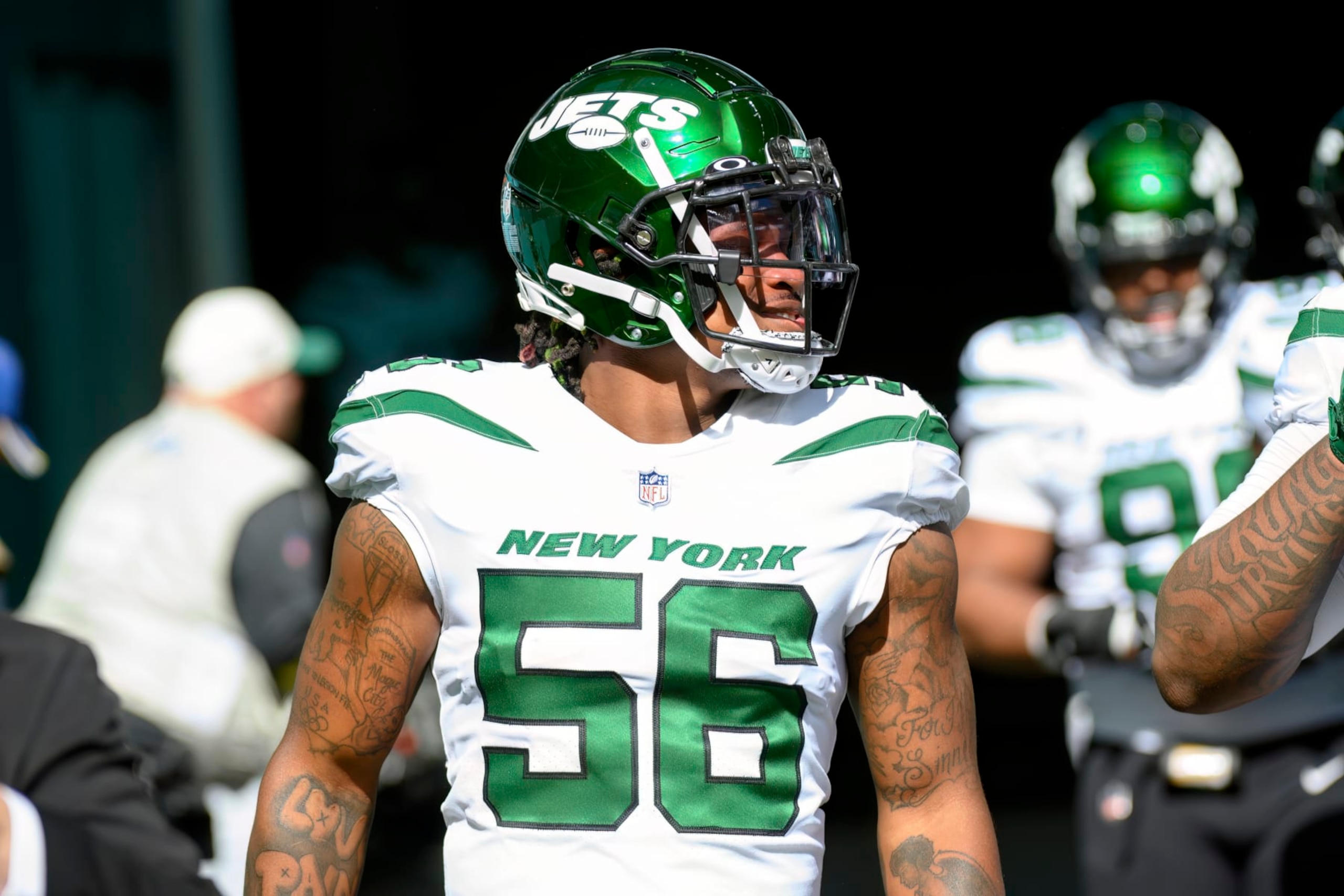 New York Jets linebacker Quincy Williams (56) walks onto the field before an NFL football game against the Miami Dolphins, Sunday, Jan. 8, 2023, in Miami Gardens, Fla. (AP Photo/Doug Murray)