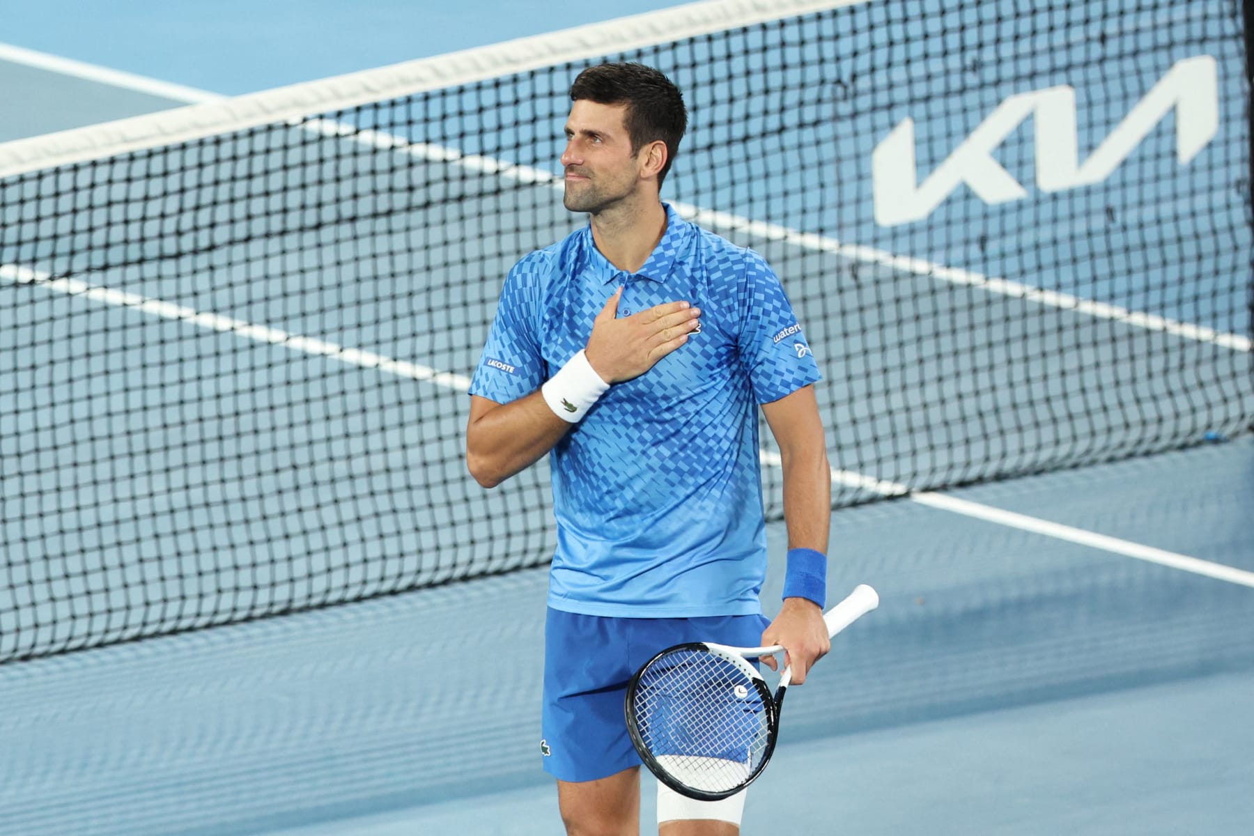 Serbia's Novak Djokovic celebrates after winning against Spain's Roberto Carballes Baena during their men's singles match on day two of the Australian Open tennis tournament in Melbourne early on January 18, 2023. - -- IMAGE RESTRICTED TO EDITORIAL USE - STRICTLY NO COMMERCIAL USE -- (Photo by Martin KEEP / AFP) / -- IMAGE RESTRICTED TO EDITORIAL USE - STRICTLY NO COMMERCIAL USE -- (Photo by MARTIN KEEP/AFP via Getty Images)