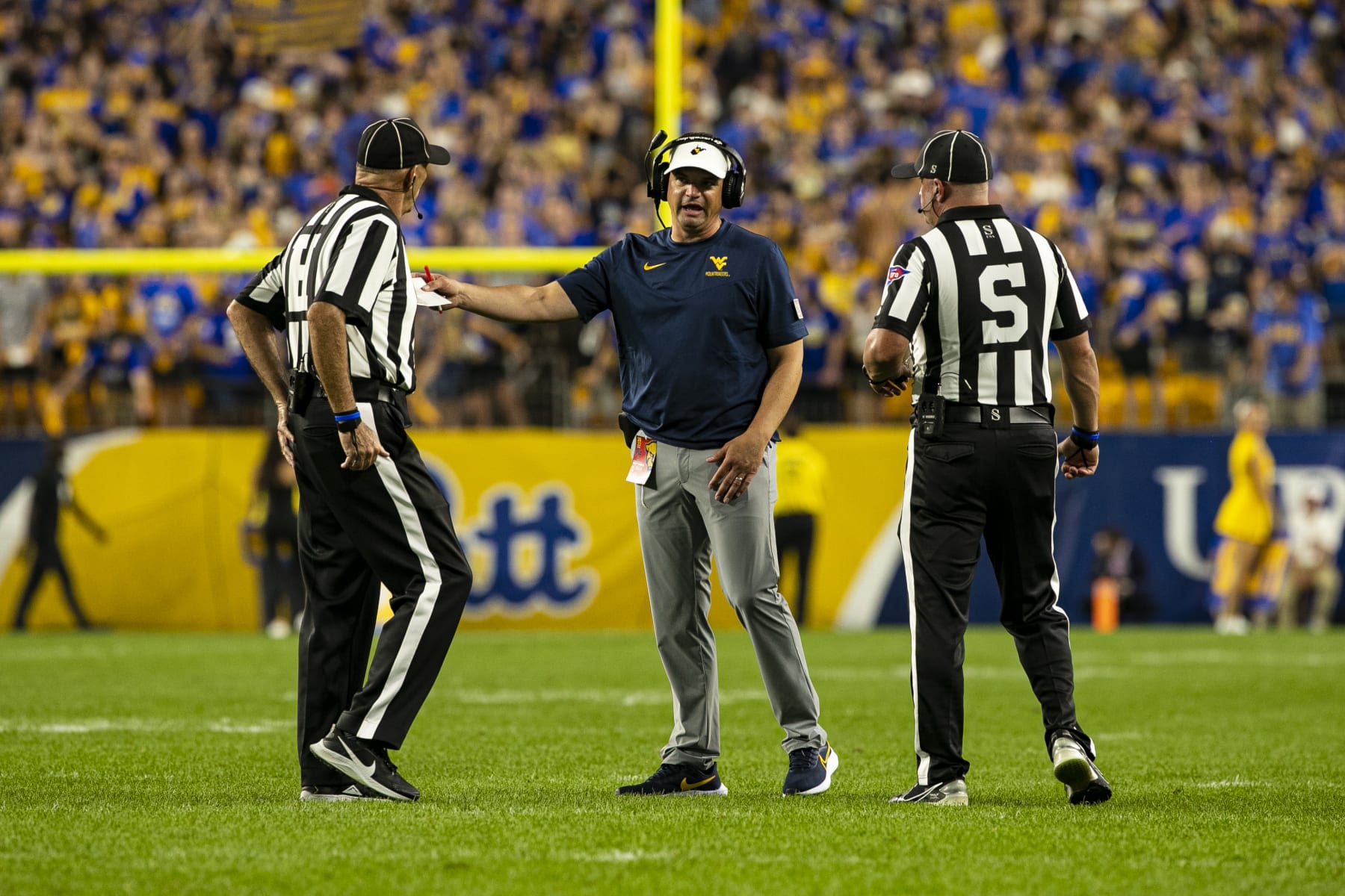 PITTSBURGH, PA - SEPTEMBER 01: West Virginia Mountaineers head coach Neal Brown talks to the referees during the college football game between the West Virginia Mountaineers and the Pittsburgh Panthers on September 01, 2022 at Acrisure Stadium in Pittsburgh, PA. (Photo by Mark Alberti/Icon Sportswire via Getty Images)