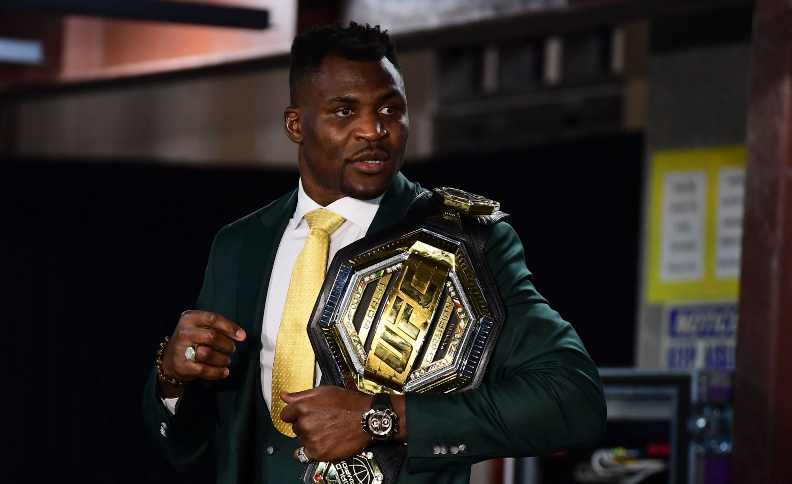 Champion Cameroon's Francis Ngannou holds the championship belt in the press room after defeating French Cyril Gane in their UFC 270 championship fight in Anaheim on January 22, 2022. (Photo by Frederic J. BROWN / AFP) (Photo by FREDERIC J. BROWN/AFP via Getty Images) Champion Cameroon's Francis Ngannou holds the championship belt in the press room after defeating French Cyril Gane in their UFC 270 championship fight in Anaheim on January 22, 2022. (Photo by Frederic J. BROWN / AFP) (Photo by FREDERIC J. BROWN/AFP via Getty Images)