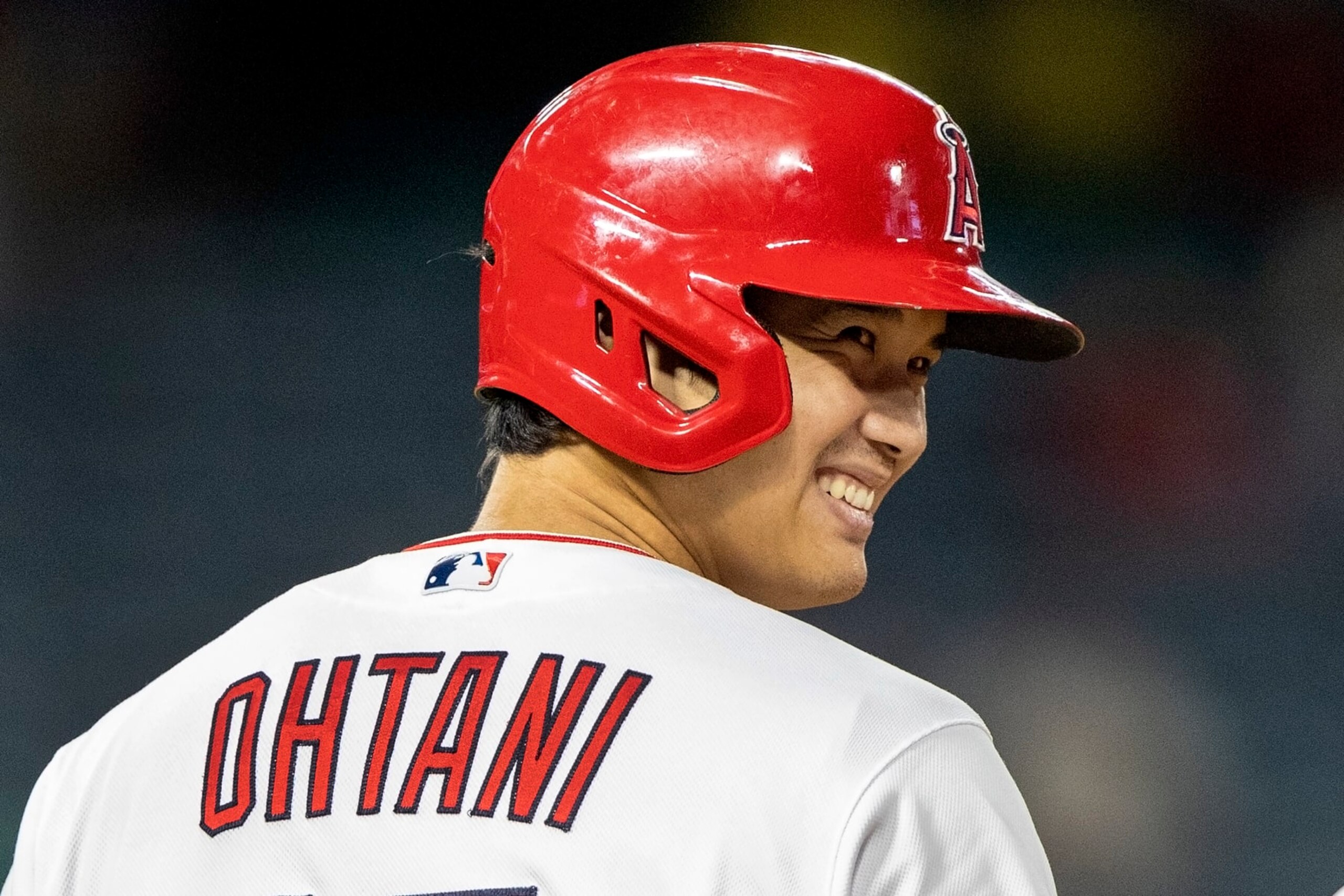 Los Angeles Angels designated hitter Shohei Ohtani smiles after hitting a single to right field against the Oakland Athletics during the fourth inning of a baseball game in Anaheim, Calif., Wednesday, Sept. 28, 2022. (AP Photo/Alex Gallardo)