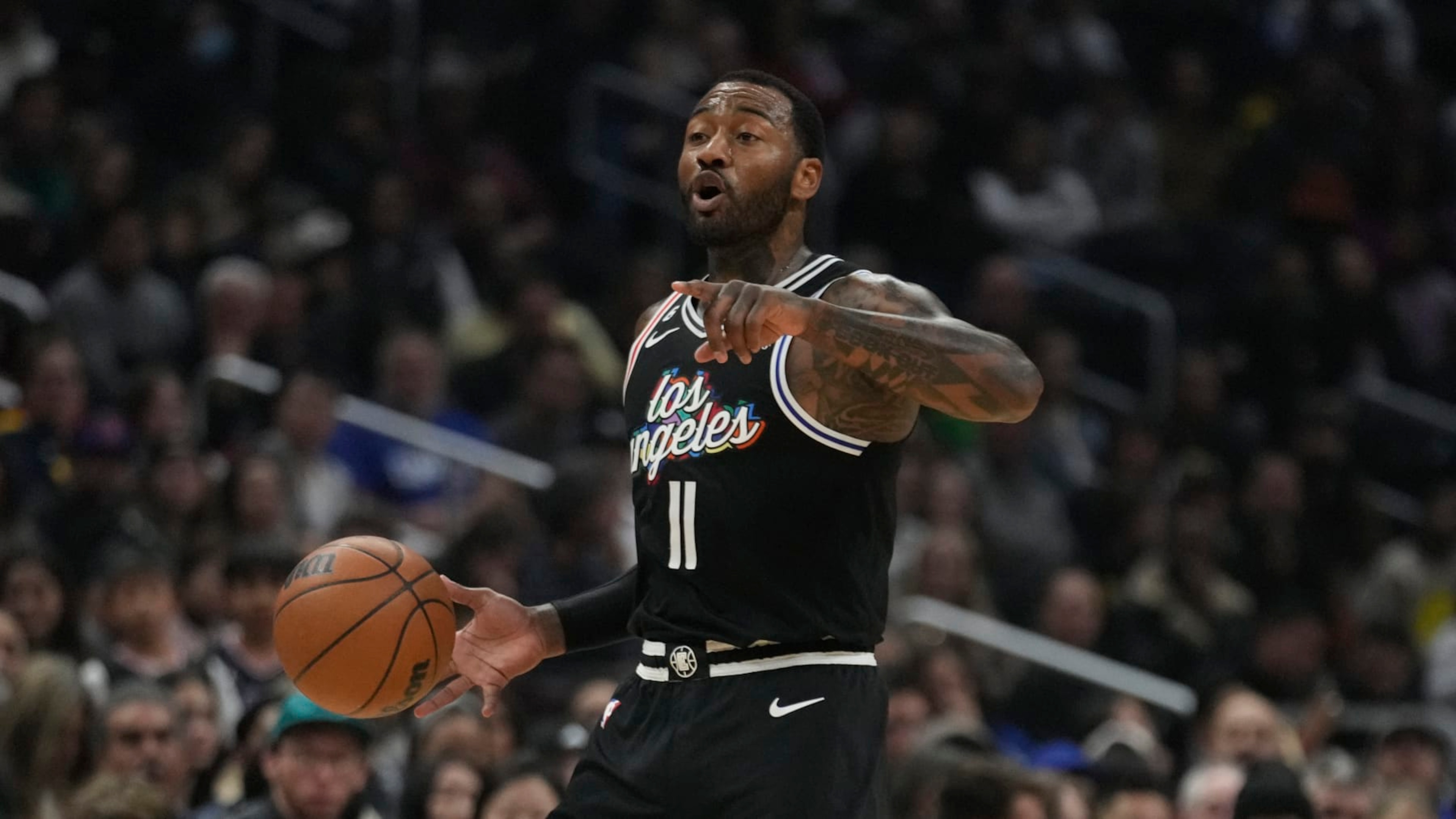 Los Angeles Clippers guard John Wall dribbles during an NBA basketball game against the Denver Nuggets Friday, Jan. 13, 2023, in Los Angeles. (AP Photo/Marcio Jose Sanchez)