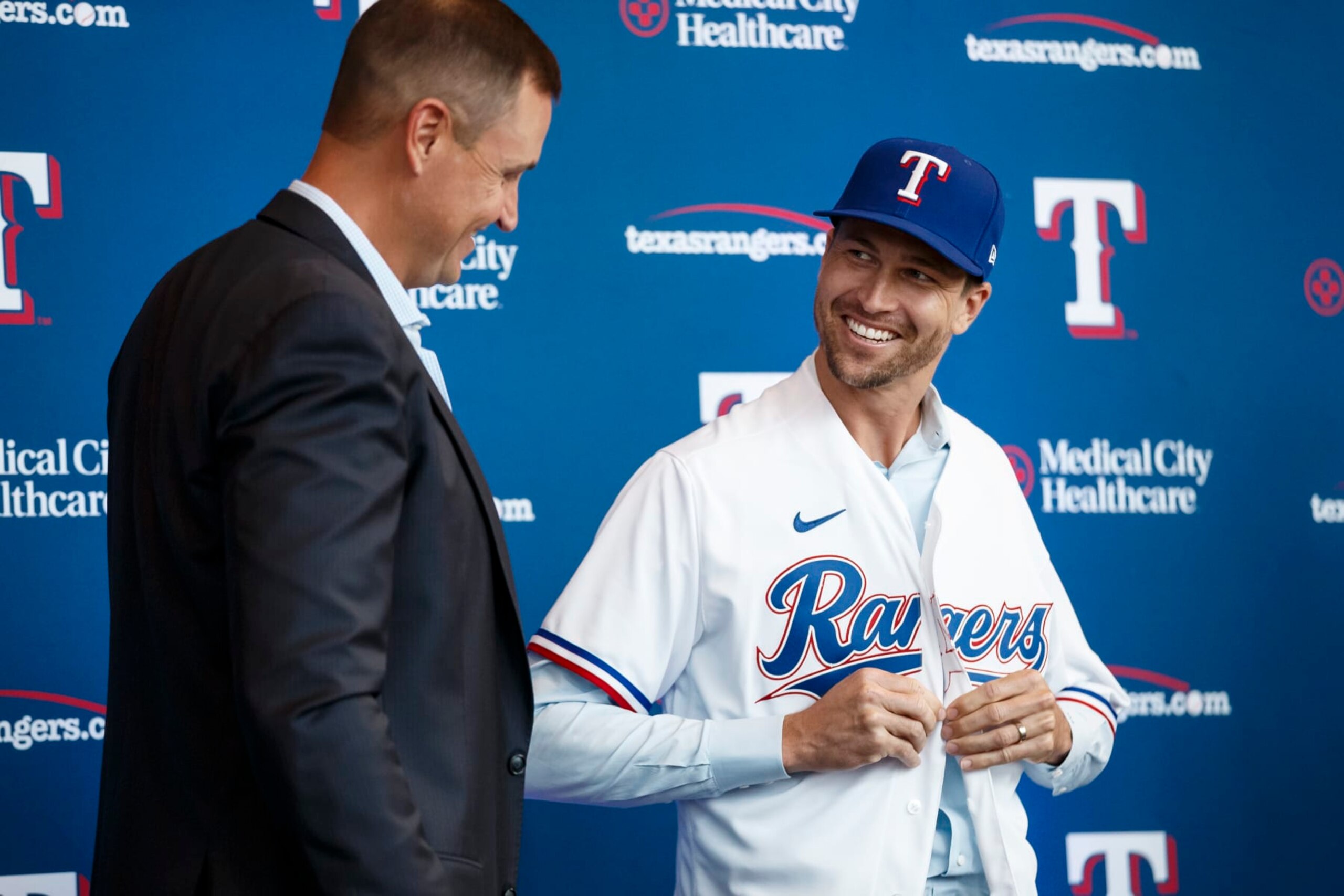 ARLINGTON, TX - DECEMBER 08: Jacob deGrom #48 and General Manager Chris Young of the Texas Rangers reacts at an introductory press conference at Globe Life Field on December 8, 2022 in Arlington, Texas. (Photo by Bailey Orr/Texas Rangers/Getty Images)