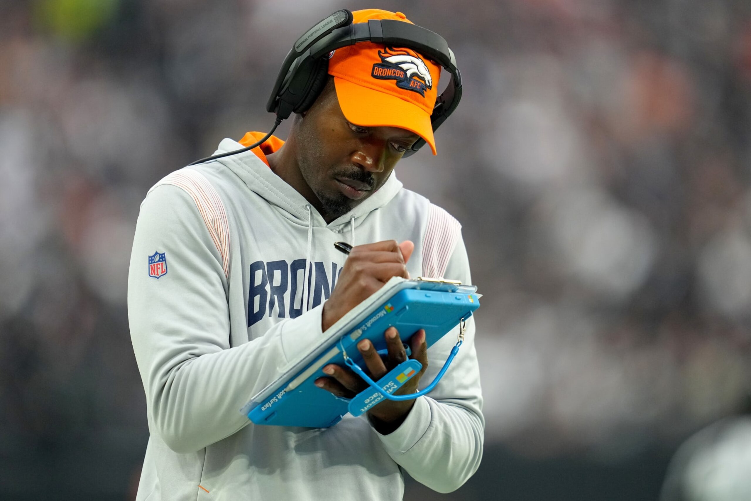 LAS VEGAS, NEVADA - OCTOBER 02: Defensive coordinator Ejiro Evero of the Denver Broncos takes notes in the fourth quarter against the Las Vegas Raiders at Allegiant Stadium on October 02, 2022 in Las Vegas, Nevada. (Photo by Jeff Bottari/Getty Images) LAS VEGAS, NEVADA - OCTOBER 02: Defensive coordinator Ejiro Evero of the Denver Broncos takes notes in the fourth quarter against the Las Vegas Raiders at Allegiant Stadium on October 02, 2022 in Las Vegas, Nevada. (Photo by Jeff Bottari/Getty Images)
